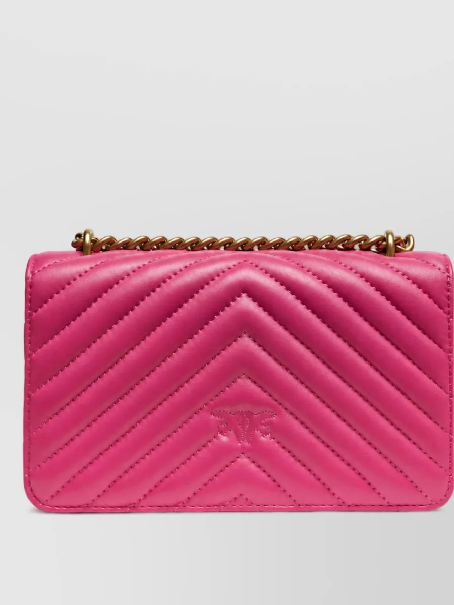 Pinko love bag one mini leather clutch bag — The Versace pink brocade bag harmonizes with the Pucci pinks and the dressy heels, keeping the palette tight and glam without adding competing prints.