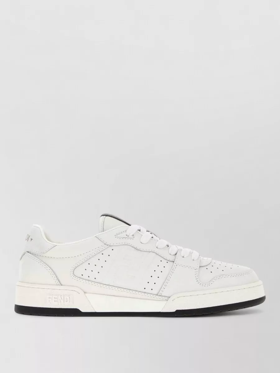 Fendi Leather lace-up sneakers — The soft white and grey low-top sneakers in A are clean and minimal with subtle branding, perfectly tying into the tee’s quiet logo story and keeping the outfit relaxed yet polished.