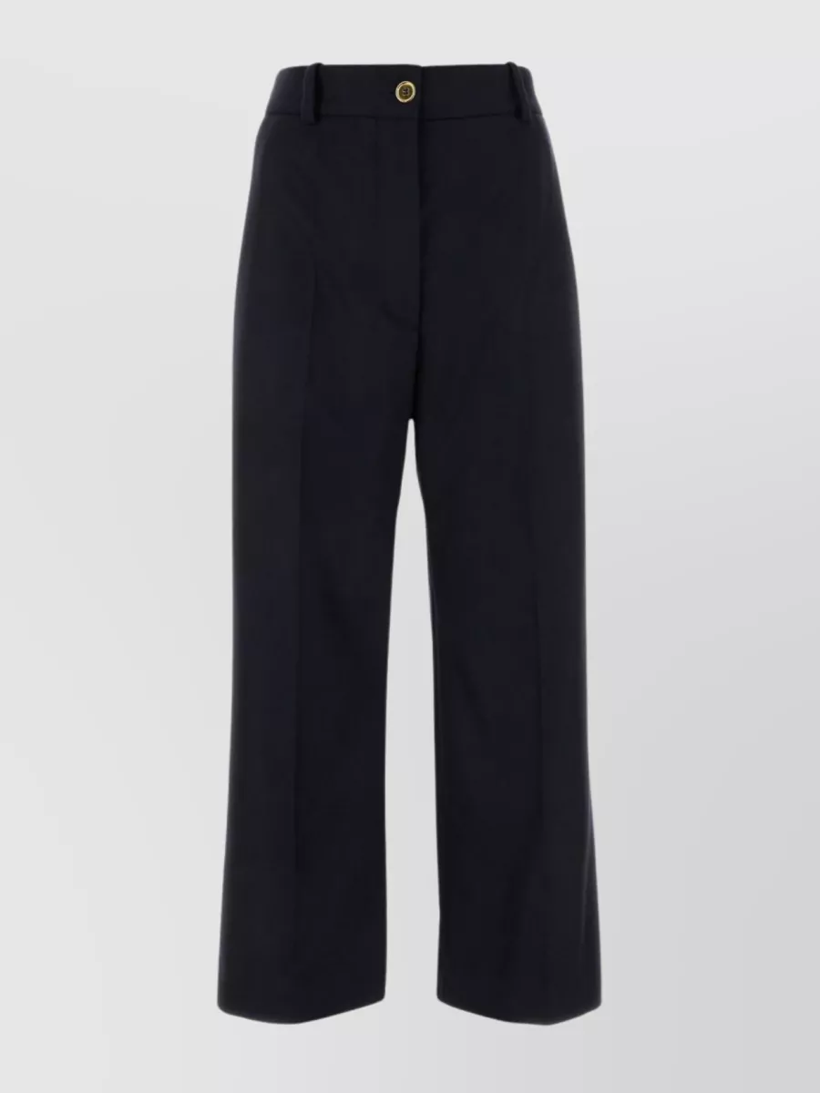 Shop Patou Flared High-waisted Wool Blend Trousers In Blue