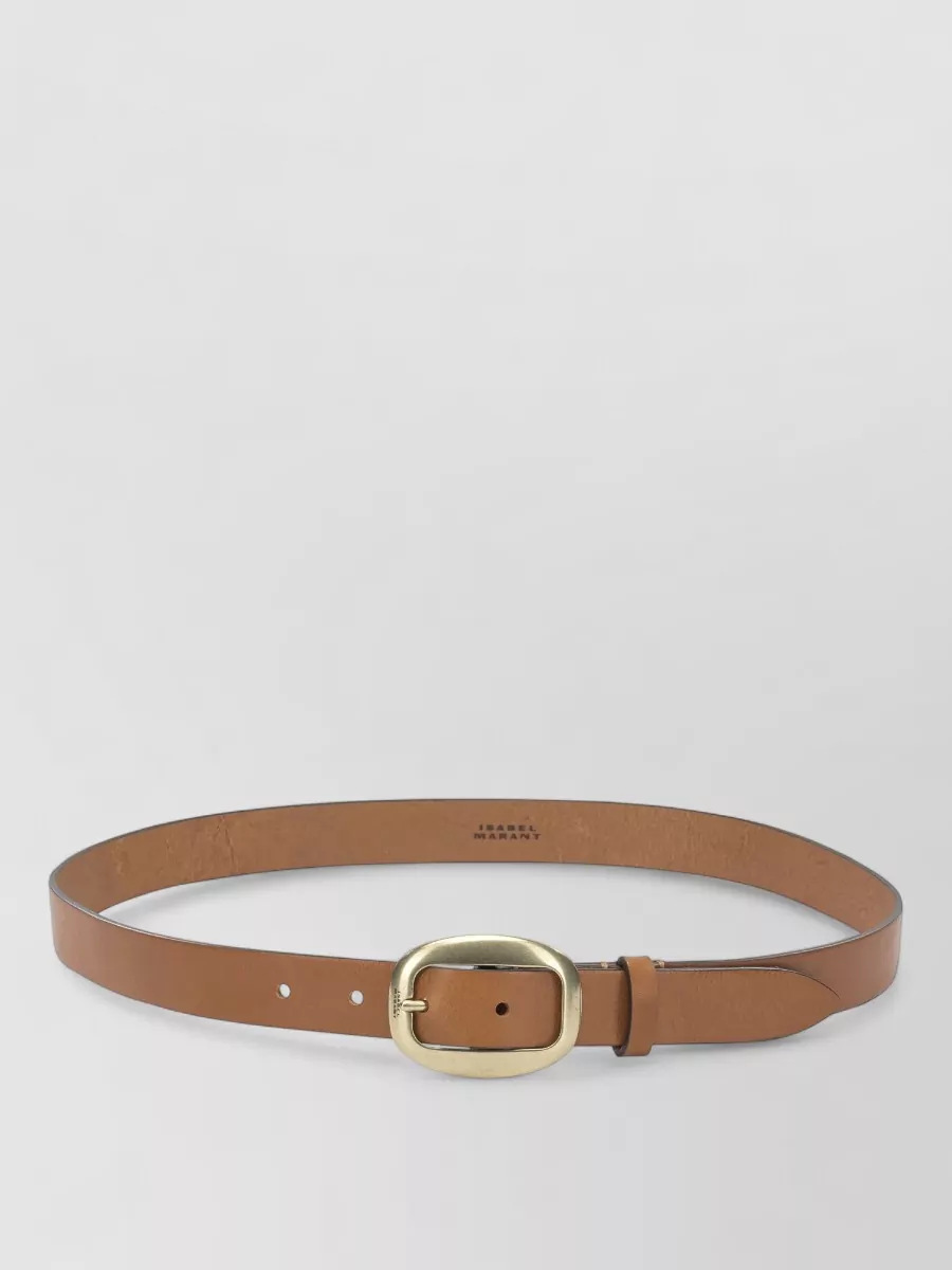 Isabel Marant Leather belt — The slim tan belt lightly defines the high waist without breaking the soft neutral column, and its brushed gold hardware adds a subtle warm accent to the earth-tone palette.