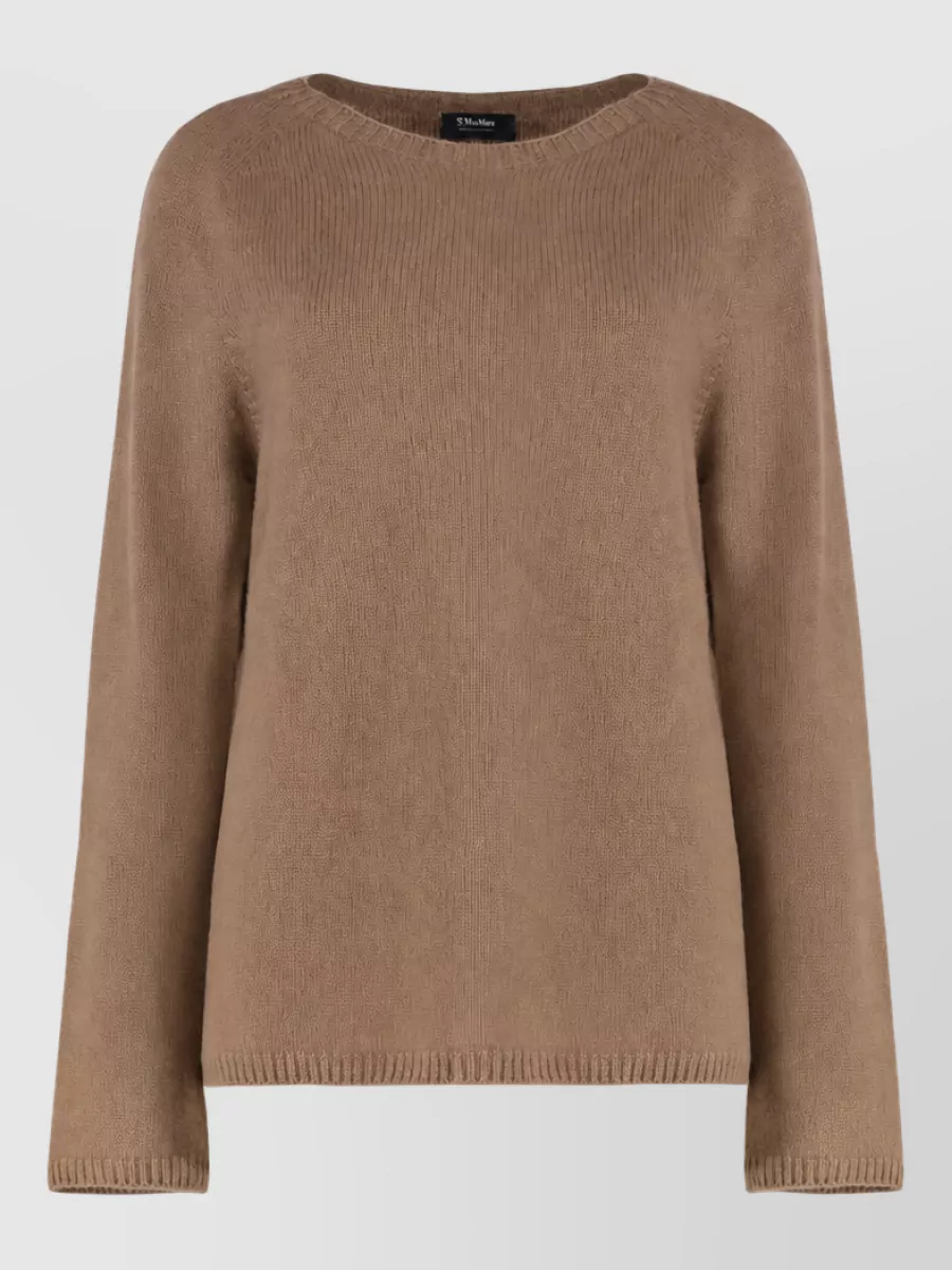 S Max Mara Cashmere wool crew neck jumper — The camel regular sweater echoes the vest’s warm lining and keeps the palette tight and minimal, creating a clean column under the sport-luxe gilet.