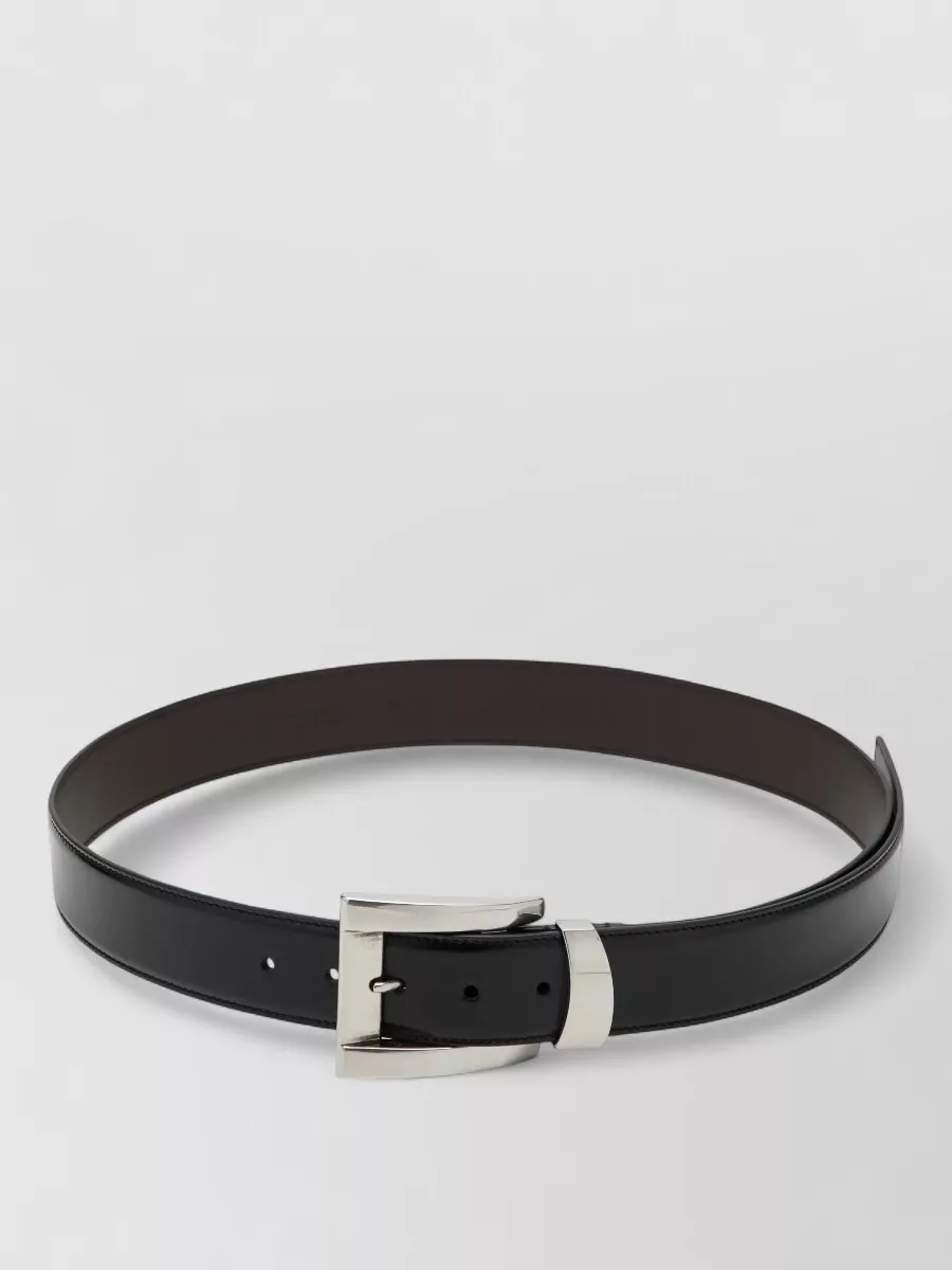 Versace Leather belt — The sleek black Versace belt with a gold buckle neatly anchors the waist and repeats the black-and-gold accents, keeping the ensemble cohesive and sharply defined.