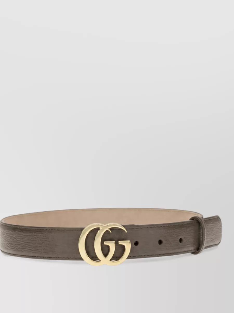 Gucci Calf leather belt — The taupe leather belt with gold double G subtly defines the high waist of the jeans and introduces a warm neutral that harmonises with both blue denim and off white accents.