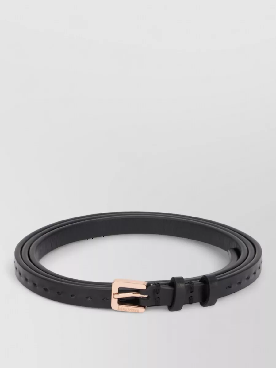 Max Mara Leather belt — The slim black belt with rose-gold hardware adds a barely-there definition at the waist, refining the high-rise trouser without interrupting the clean monochrome minimalism.