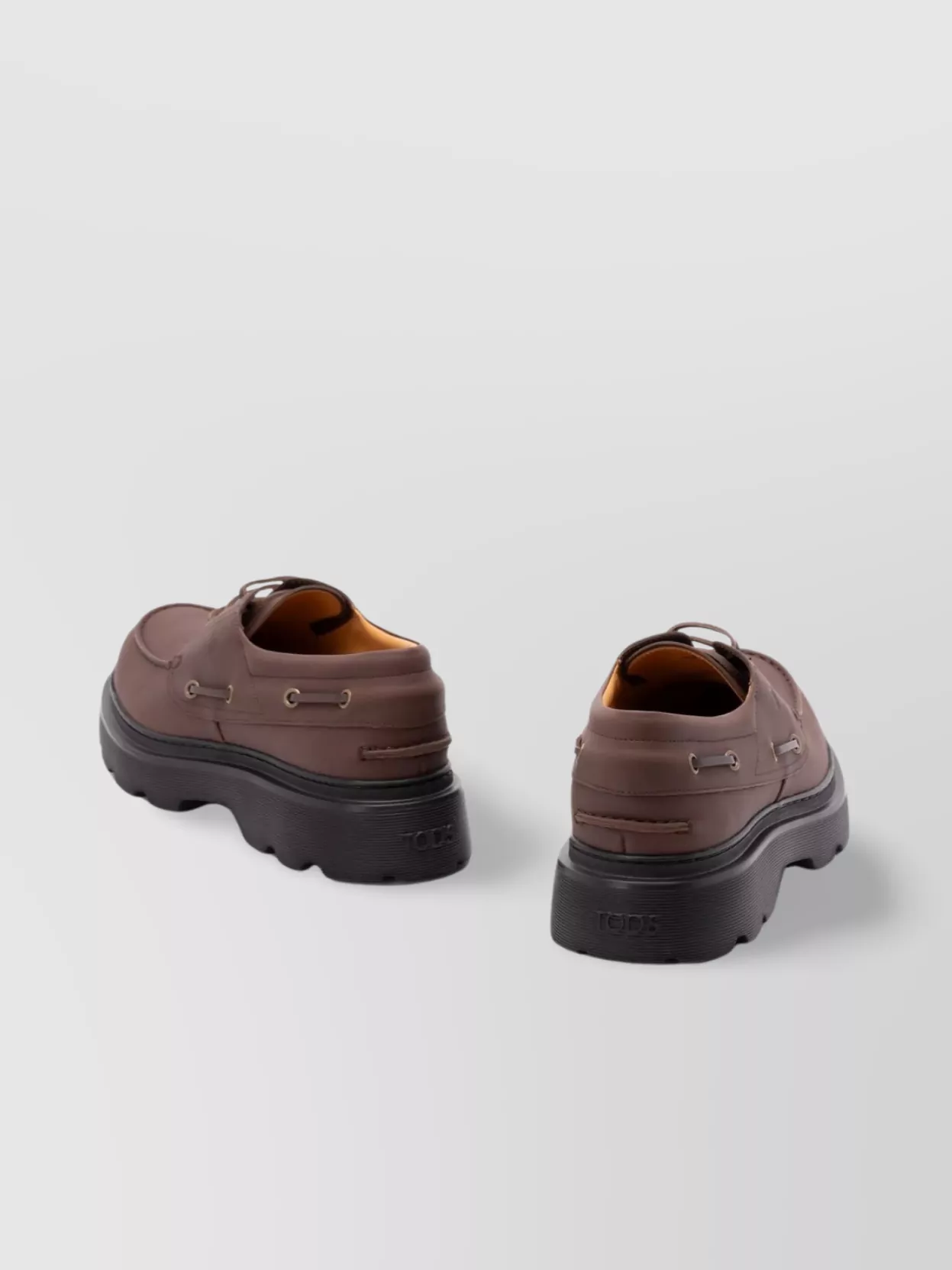 Tod's Boat Shoes With Chunky Sole And Eyelet Detailing