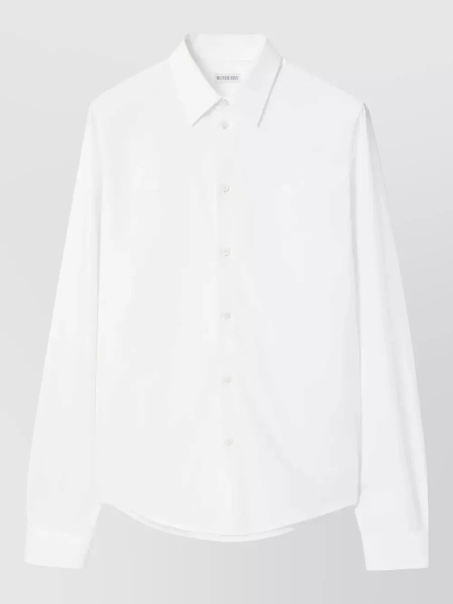 Burberry Cotton poplin regular-fit shirt — The coat is minimalist, tailored and quietly luxurious, so a clean white shirt keeps the look sharp and modern under the black outerwear without adding conflicting Burberry checks, letting the coat’s subtle collar check be the only pattern note.