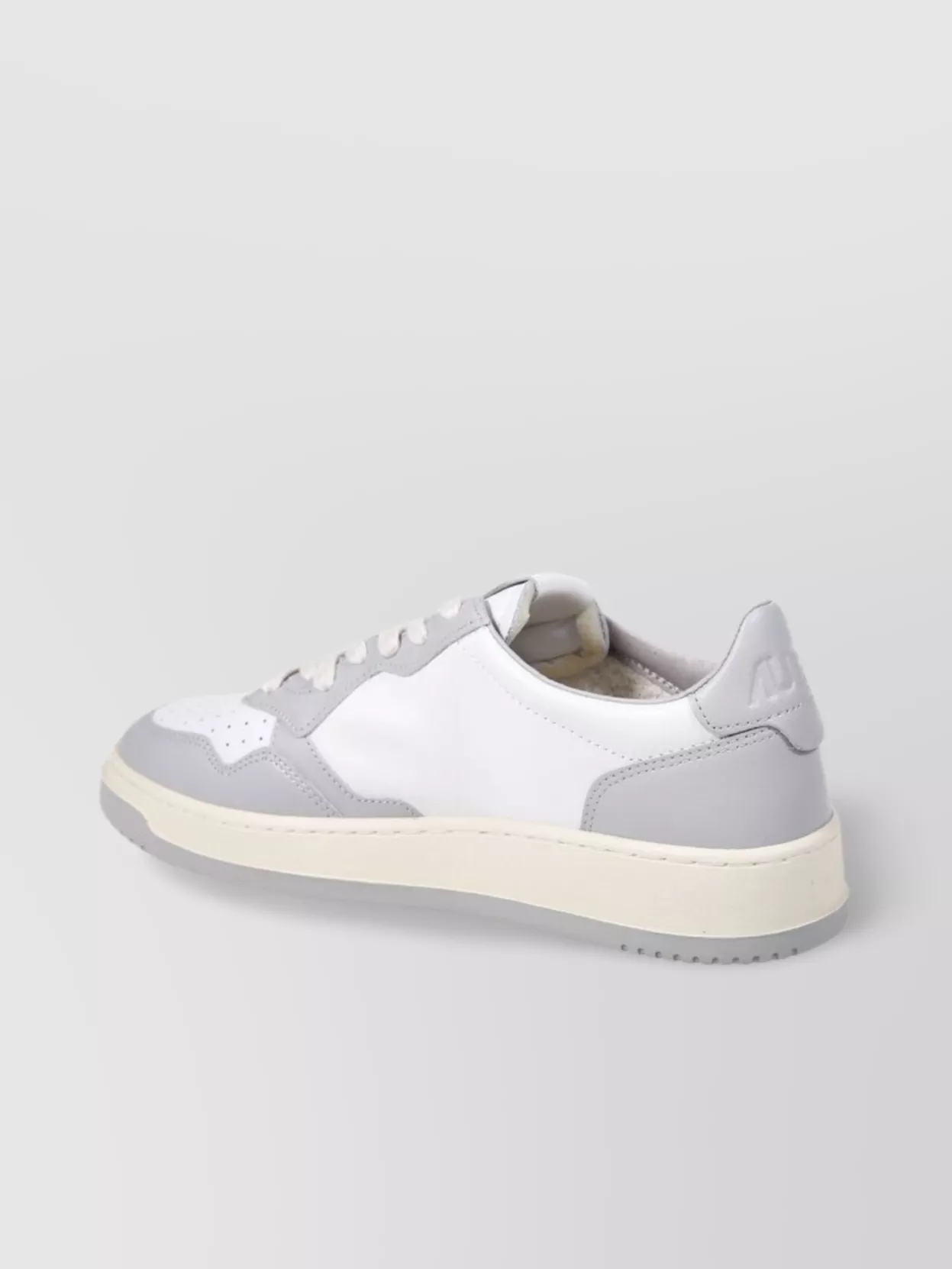 Autry Low Sneaker With Contrast Sole And Perforated Toe