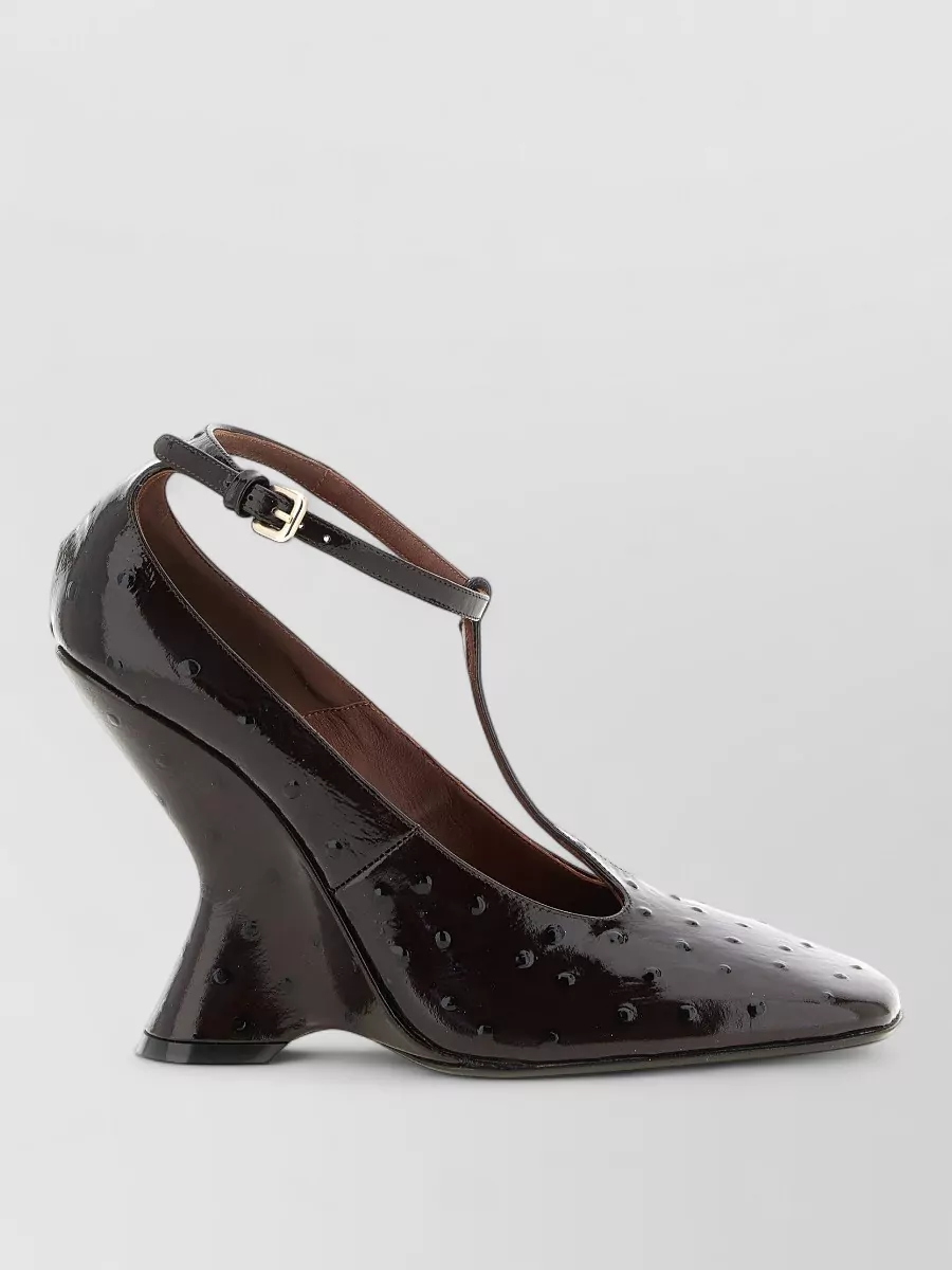 Dries Van Noten Sculptural heel pumps — The sculpted Mary Jane in espresso is Dries, formal enough for cocktails, and its dark brown works as a soft neutral under the rich plum and teal tones without adding more print drama.