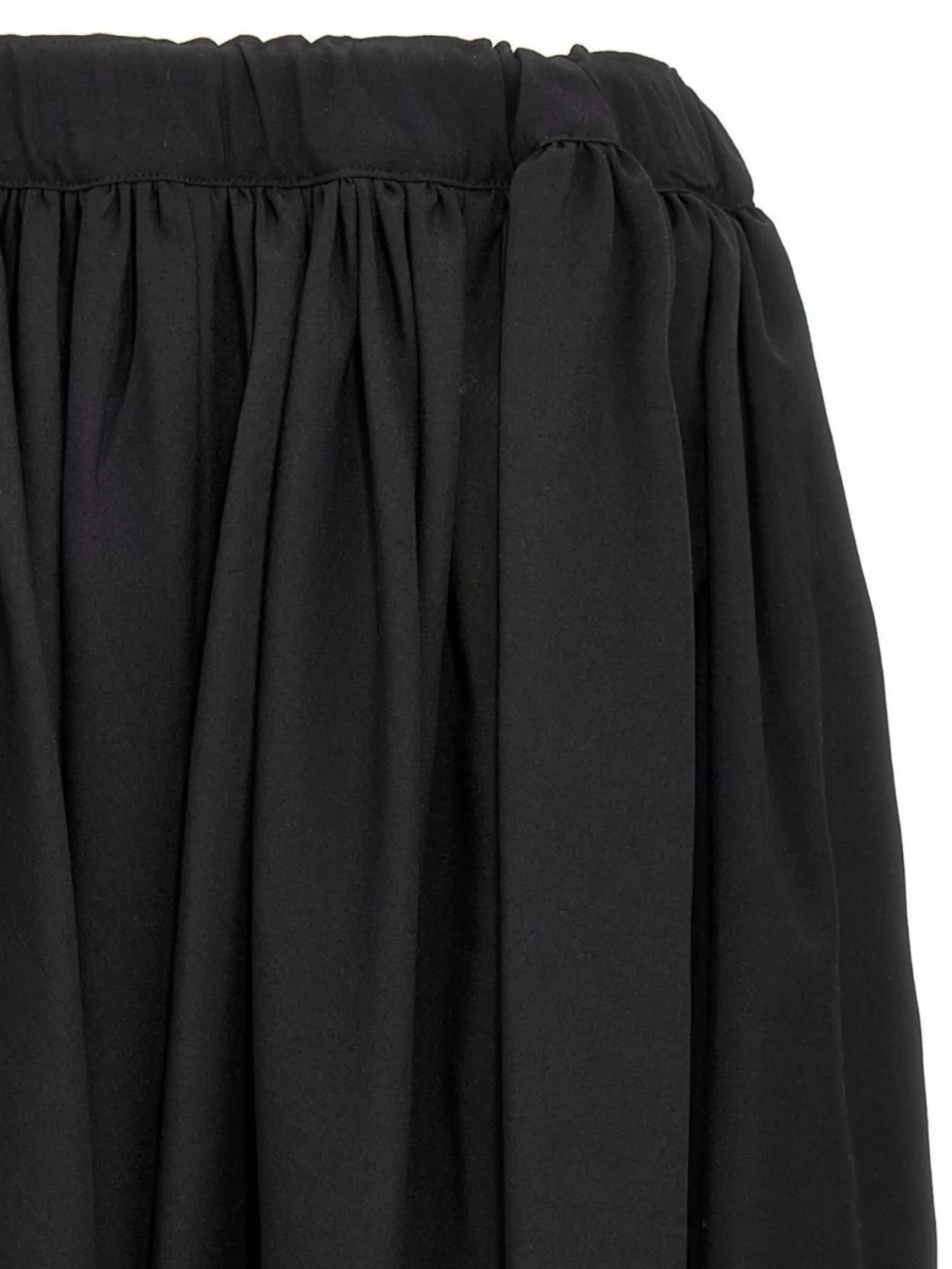 COMME DES GARÇONS VOLUMINOUS PLEATED TROUSERS EXUDE FLAIR 