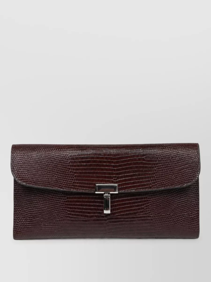 Totême leather clutch bag