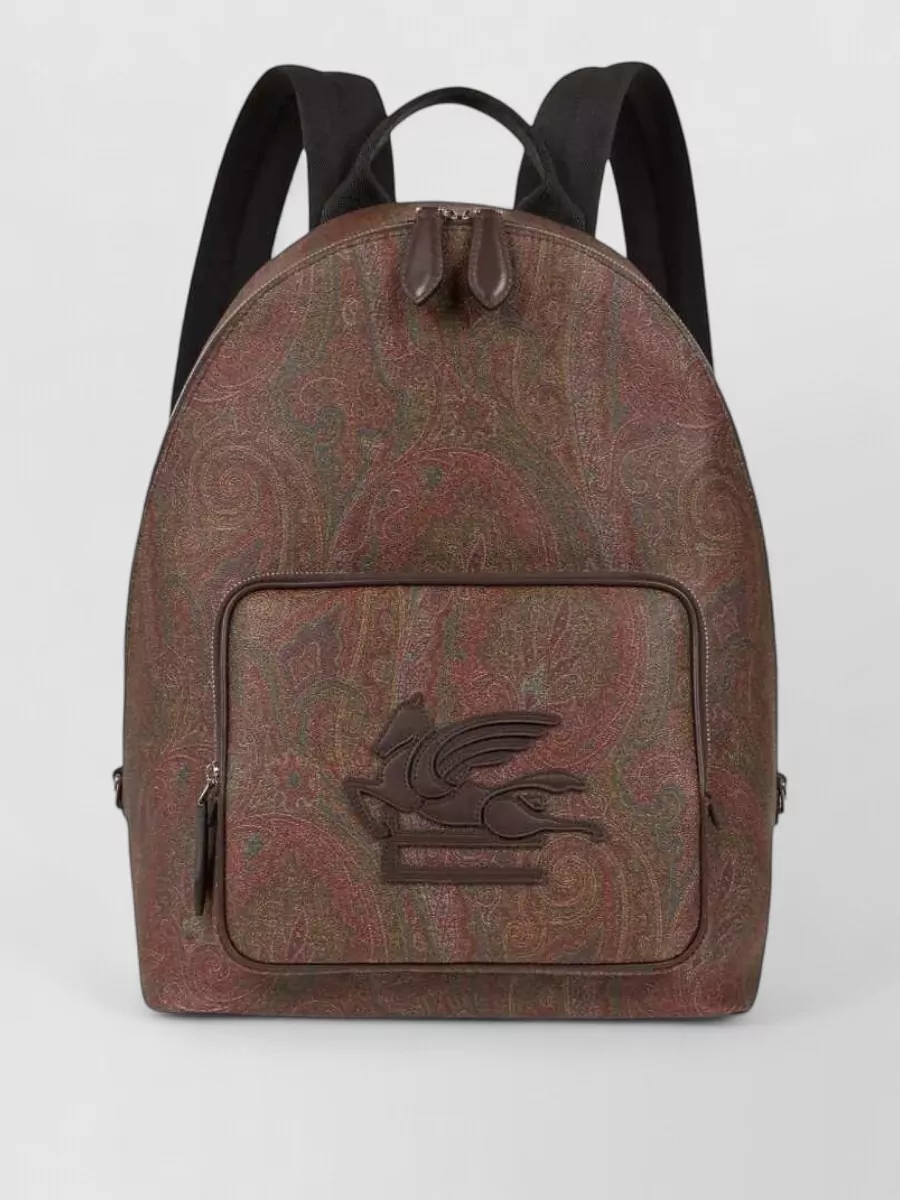Etro Paisley print backpack — The Etro paisley tote mirrors the sweater’s romantic boho language and autumnal tones while staying structured and polished enough to sit comfortably with tailored trousers and Chelsea boots.