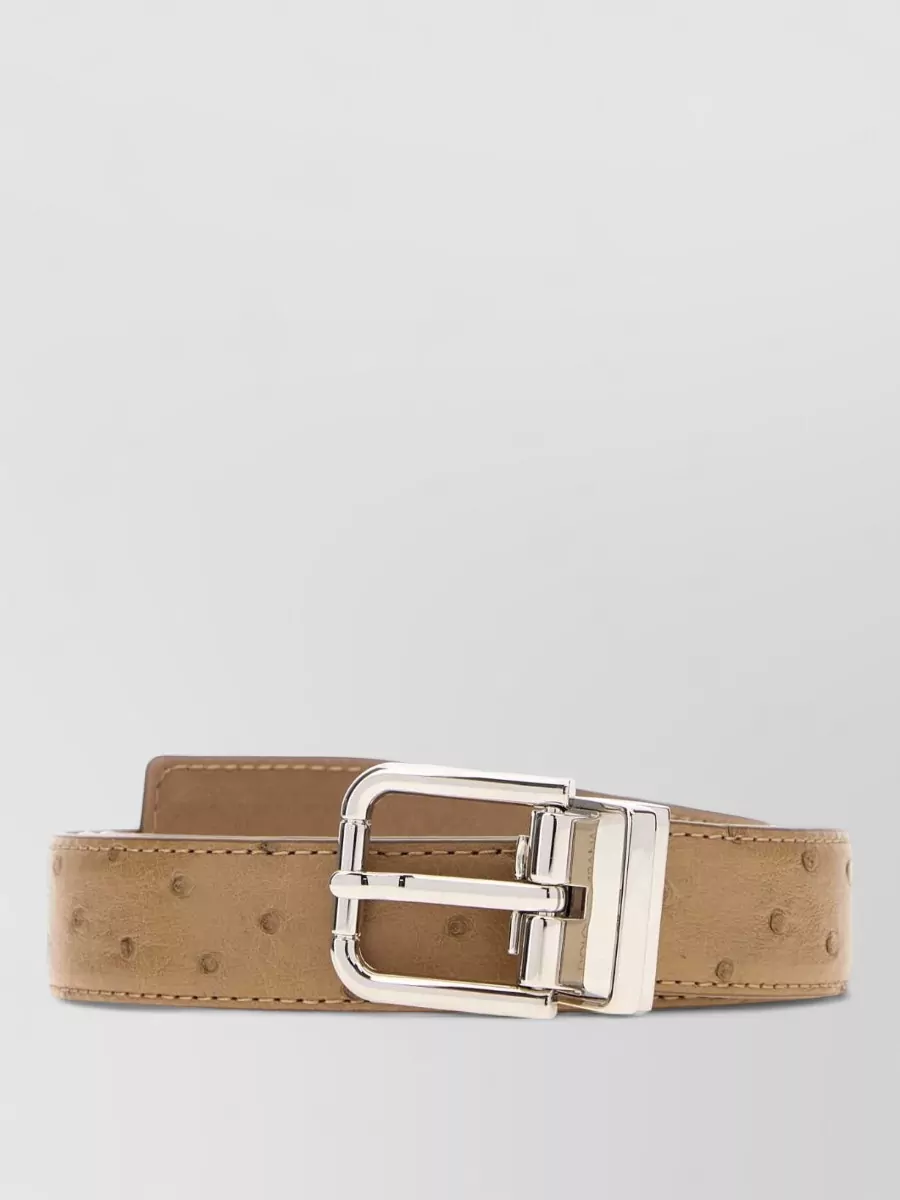 Dolce&Gabbana Leather reversible belt — The simple black belt with silver buckle adds subtle structure at the waist without fighting the shirt’s print or shifting the vibe away from relaxed tailoring.