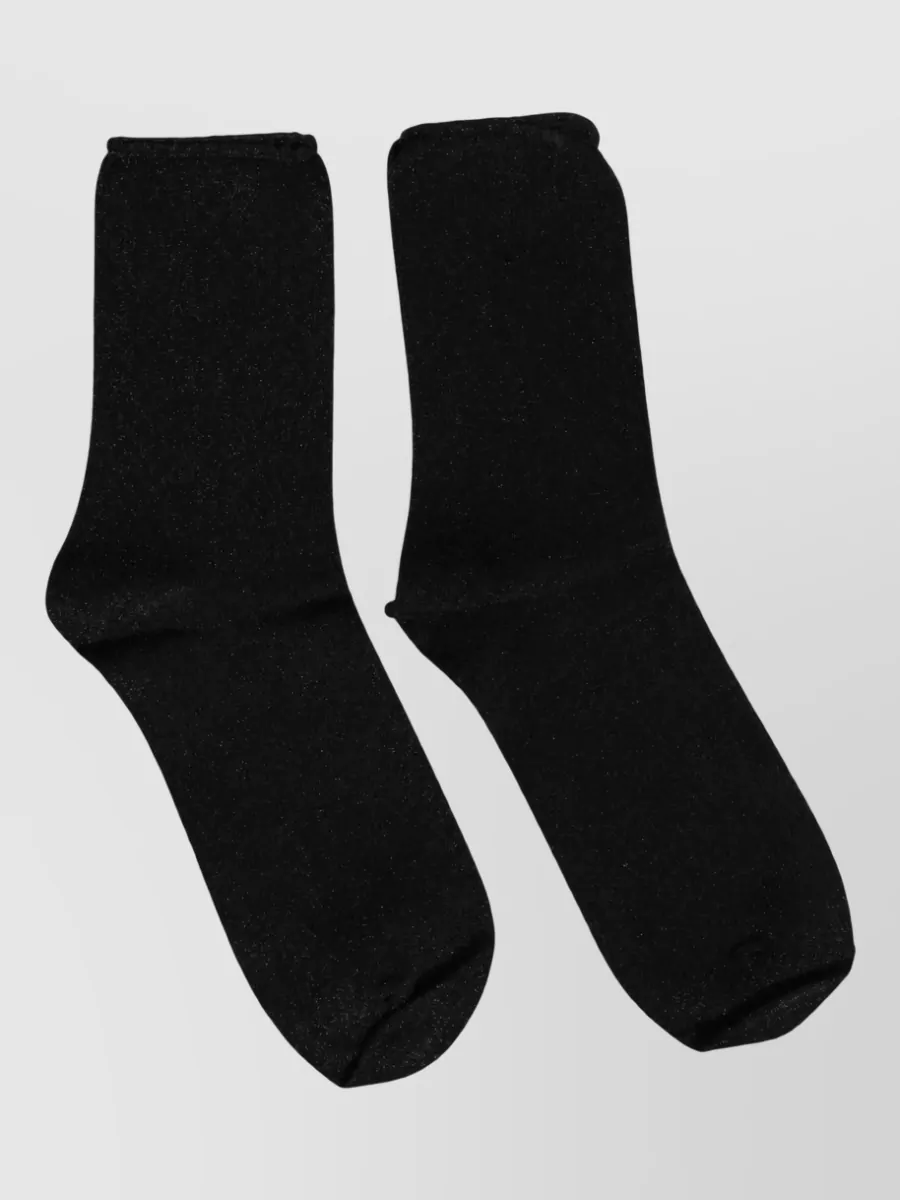 Dolce&Gabbana Viscose mid calf socks — The black ankle socks with a discreet metallic fleck tie into the black sneakers and top, adding a nightlife glint that suits the y2k baroque mood without introducing extra color.