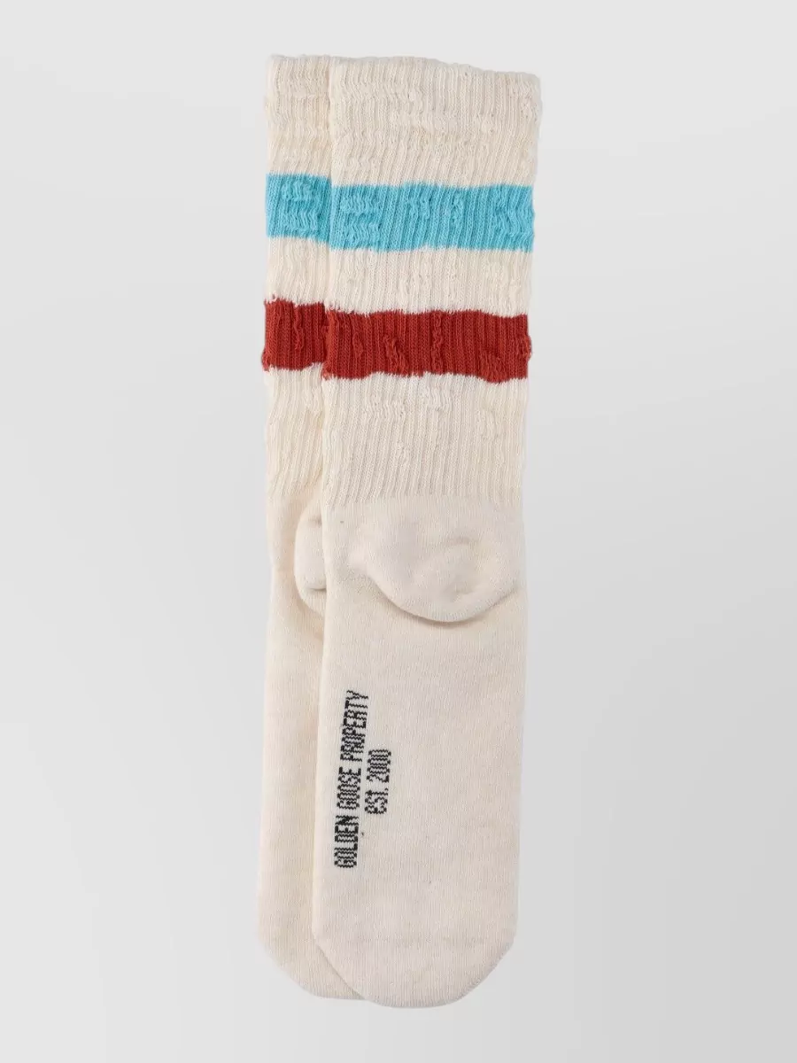 Golden Goose Ribbed striped socks — The Golden Goose tube socks quietly repeat the polo’s yellow and the tote’s warm tones, giving a subtle collegiate detail that ties the sporty elements together.