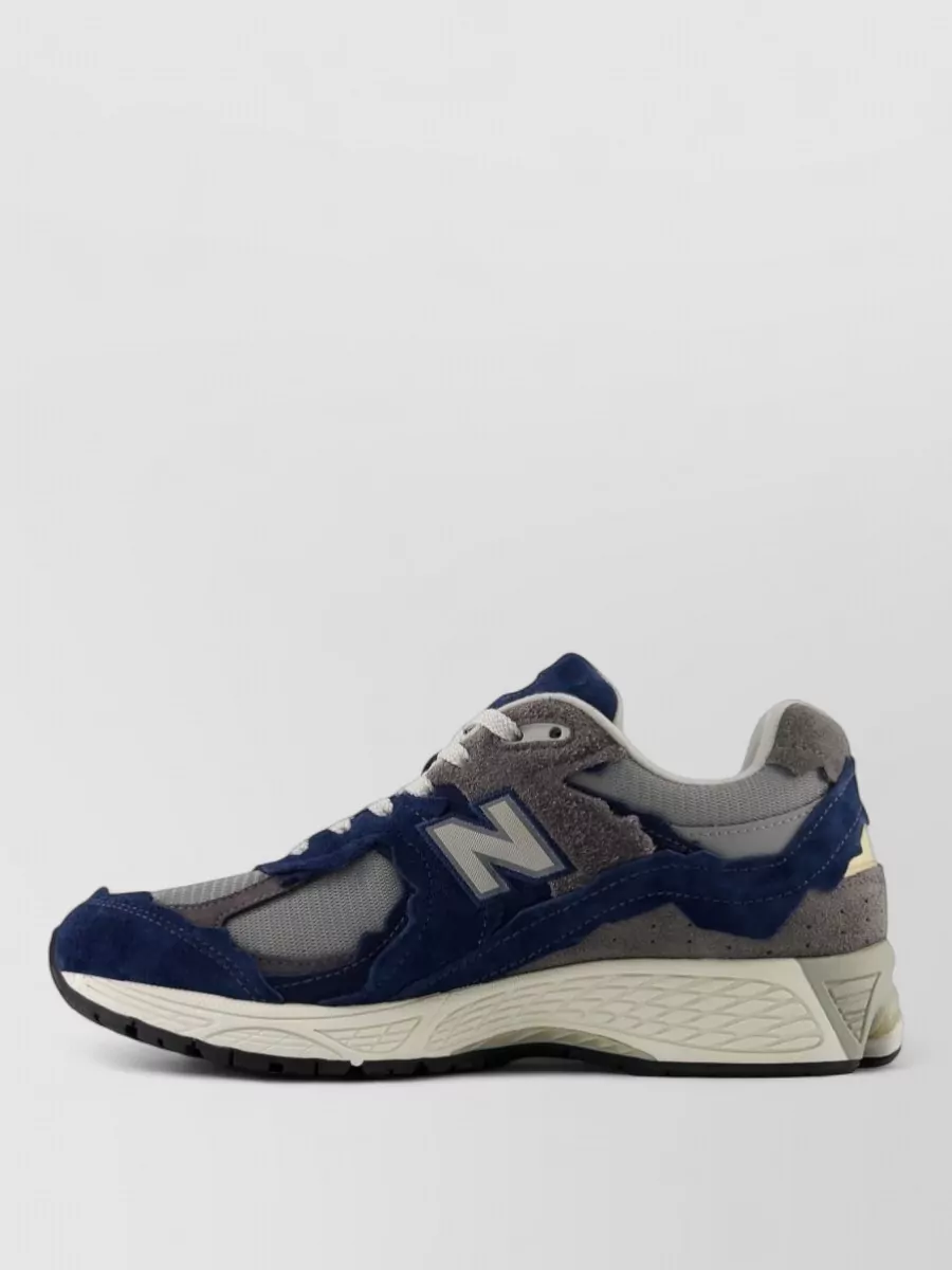 New Balance Paneled Low-Top Sneakers