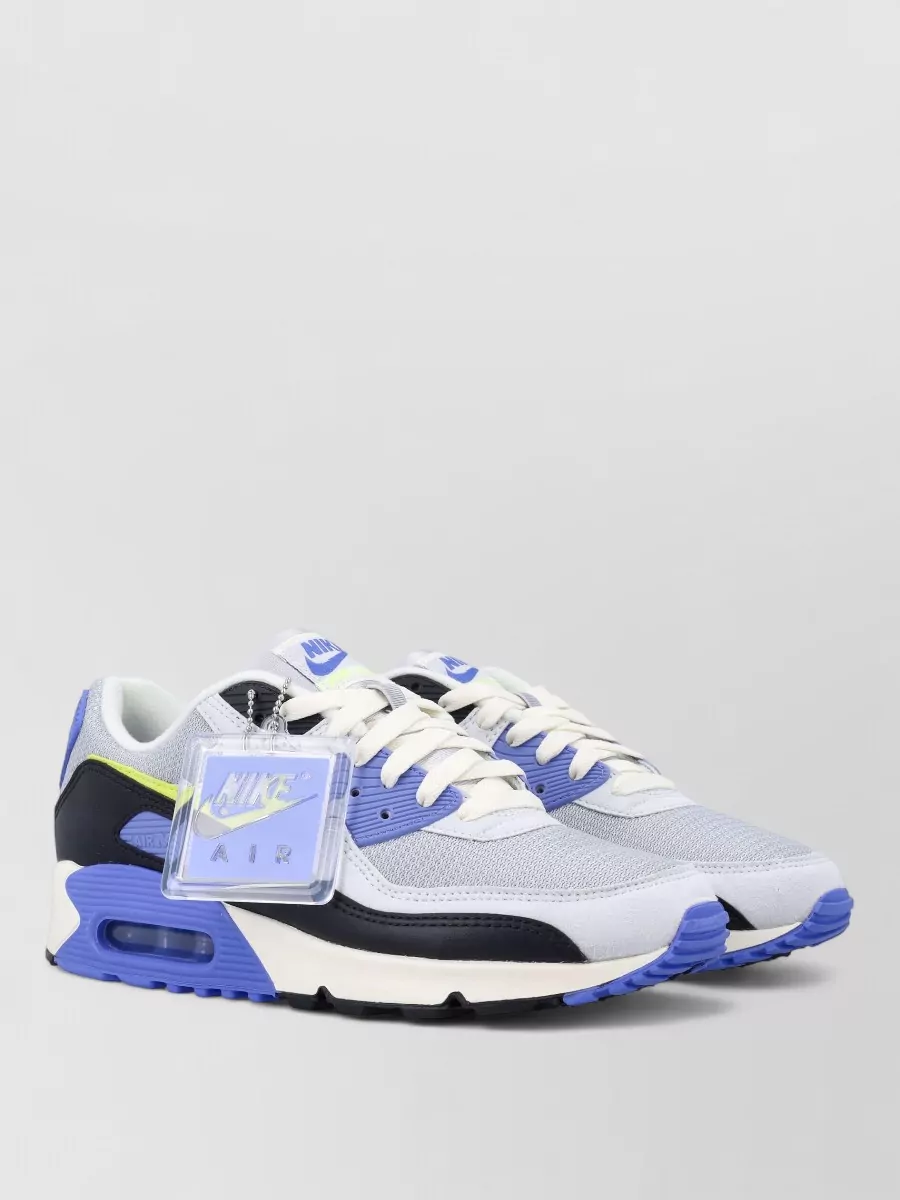 Nike Air max iii low-top sneakers — The Nike chunky sneakers lean into the streetwear brief, and their cobalt accents subtly pick up the blue tones of the denim while keeping the outfit practical and punchy.