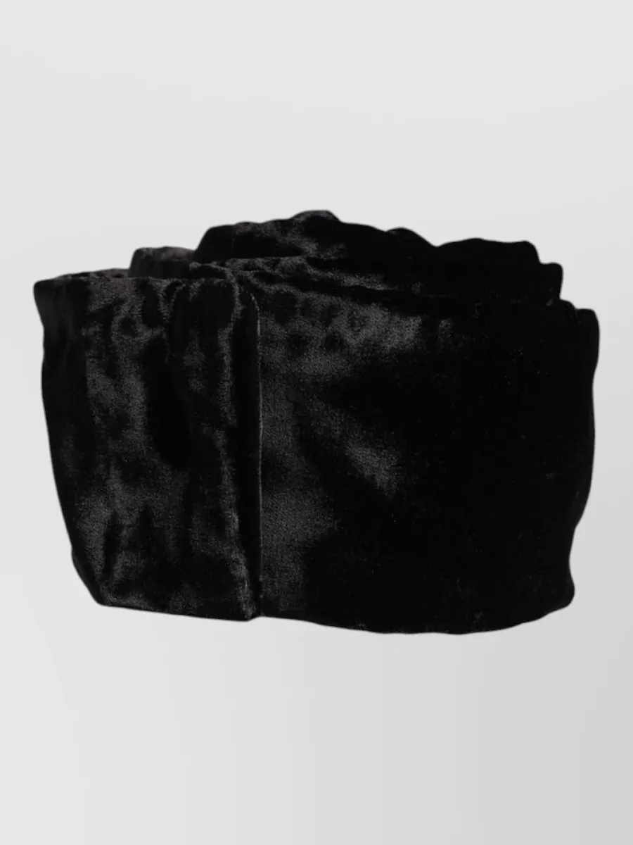 Dolce&Gabbana Satin waist belt — The Dolce & Gabbana black velvet scarf can be loosely draped or tied at the neck for extra winter drama, matching the gown’s crushed velvet texture while staying quietly luxurious.
