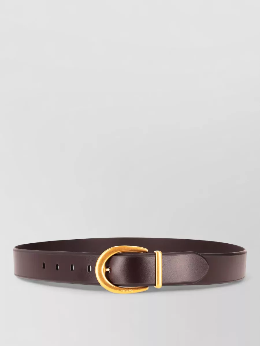 Prada Leather belt — The Prada dark-chocolate belt can subtly define the waist over the elastic waistband and keeps the palette cohesive without drawing attention away from the clean lines.