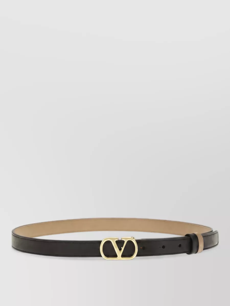 Valentino Garavani Calf leather reversible belt — A slim black VLogo belt crisply defines the high waist of the jeans, sharpening the proportions while keeping the overall effect minimal and in line with the quiet-luxury aesthetic.
