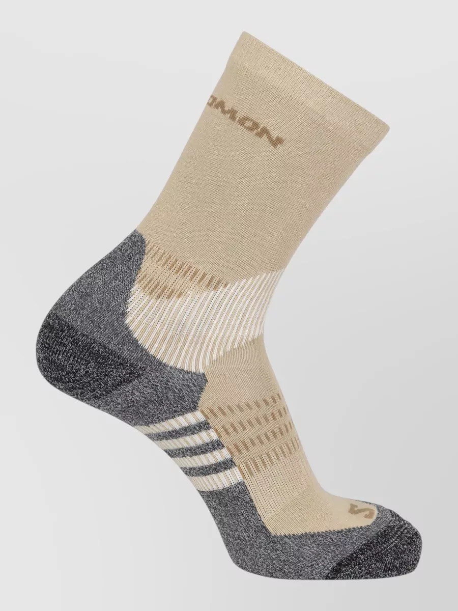 Salomon Crew socks 2-pack — The white-and-black Y-3 crew socks introduce a subtle graphic stripe that ties into the sporty theme and will frame the runners cleanly without breaking the monochrome story.