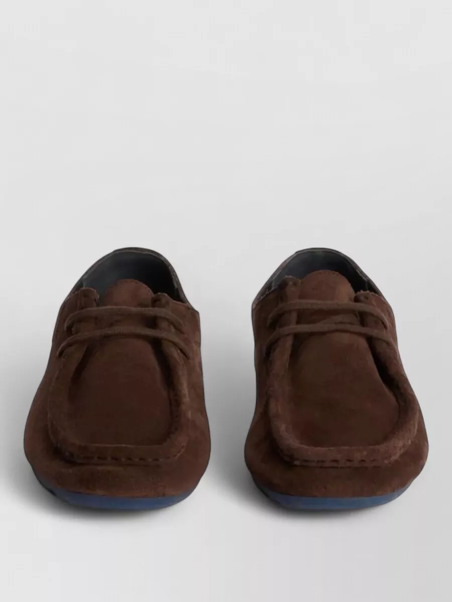 Jil Sander Suede leather lace-up loafers — The Jil Sander chocolate moccasin loafer sits in the same quiet-luxury tier, matches the rich browns of both bag and dress, and keeps the outfit understated and city-appropriate for cooler seasons.