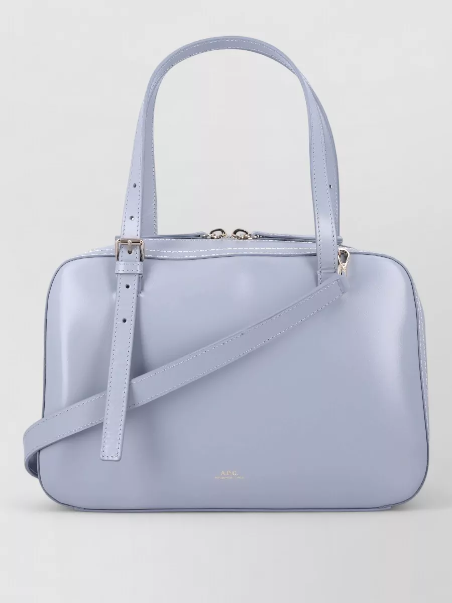 A.P.C. virginie leather shoulder bag — The A.P.C. periwinkle shoulder bag echoes the soft blue cardigan without being matchy, and its structured, minimalist shape reinforces the clean, refined mood of the outfit.