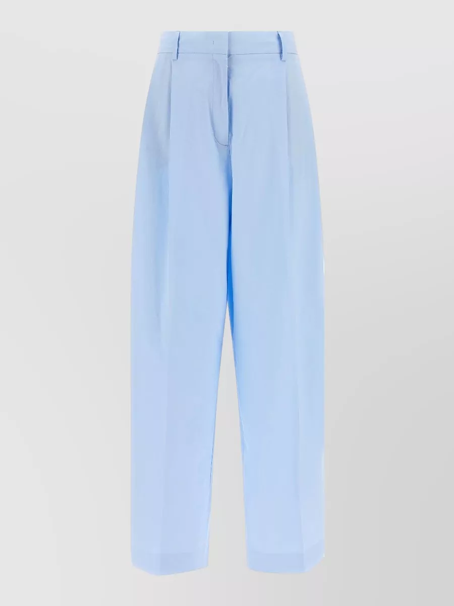 Fabiana Filippi Cotton high-rise wide-leg tailored trousers — The powder-blue tailored trouser introduces a subtle, refined colour contrast to the nude loafers, its high-rise tapered cut balancing the soft shoe with a clean, elongated silhouette suitable for smart days.