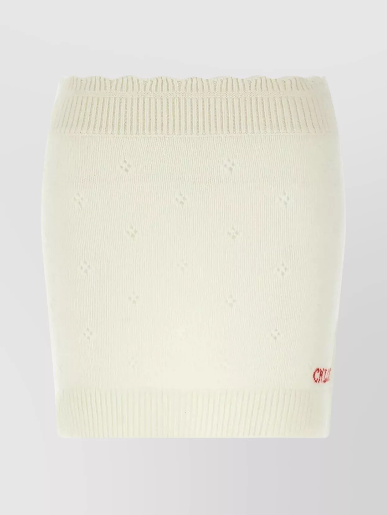 Chloé Cashmere wool openwork knitted mini skirt — The Chloé ivory and scarlet knit mini echoes the sweater’s cream‑red varsity palette and cosy texture, creating a cohesive minimalist-preppy knit set that still feels quietly luxurious and off-duty.