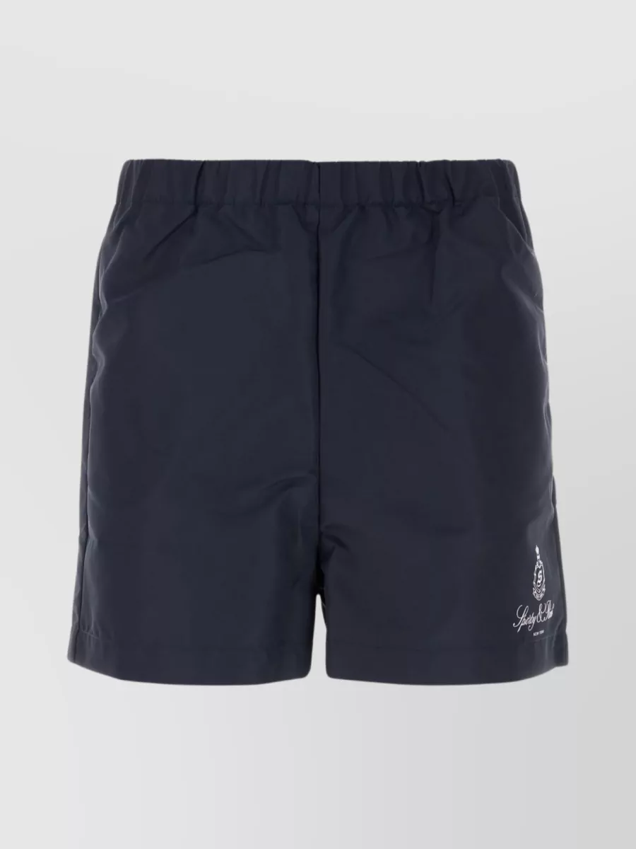 Shop Sporty And Rich Nylon Bermuda Shorts With Elastic Waistband And Seam Pockets In Blue