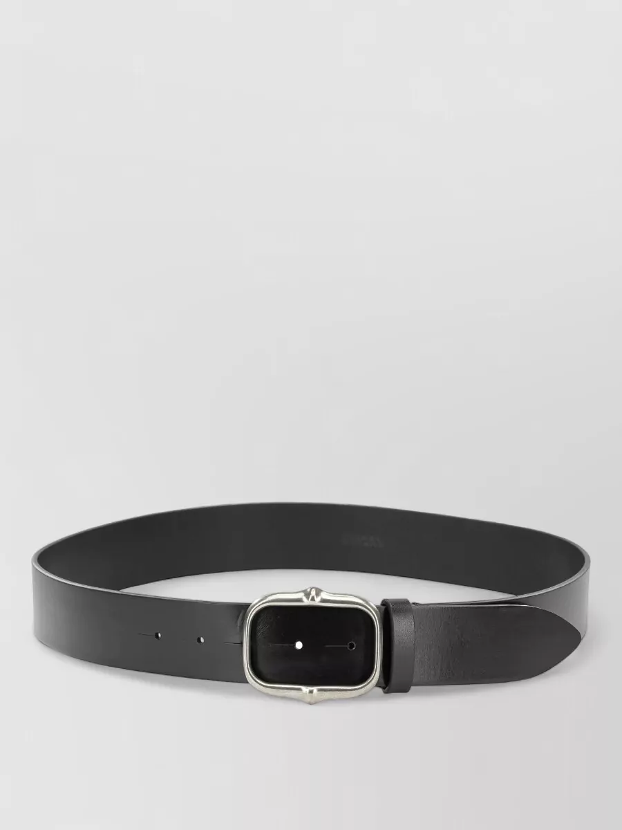 Isabel Marant Leather belt — The slim black belt with silver buckle quietly defines the high waist, tying into the silver denim hardware and keeping the monochrome scheme tight and considered.