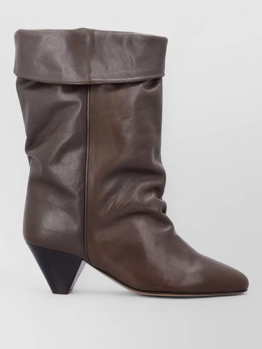 Isabel Marant Leather ankle boots — The chocolate slouchy cone-heel boot brings Isabel Marant’s signature nonchalance, the right mid-formality, and a warm depth that grounds the grey knit and charcoal trouser without feeling heavy.