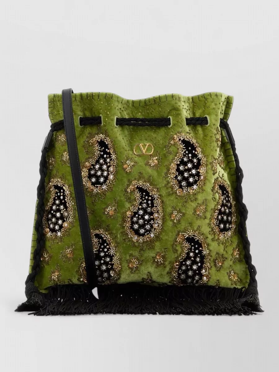 Valentino Garavani nellcôte velvet bucket bag — The Valentino Garavani olive beaded paisley bucket mirrors the dress’s deep olive tones and graphic energy, leaning into a rich boho-y2k cocktail mood while staying firmly in the same luxury tier.