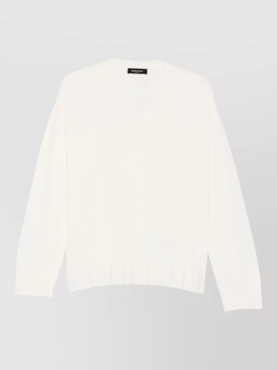 Fabiana Filippi Silk wool cashmere crewneck sweatshirt — The soft ivory V-neck layers cleanly under the beaded camel jacket, echoing its quiet-luxury polish while adding light near the face without competing with the embellishment.