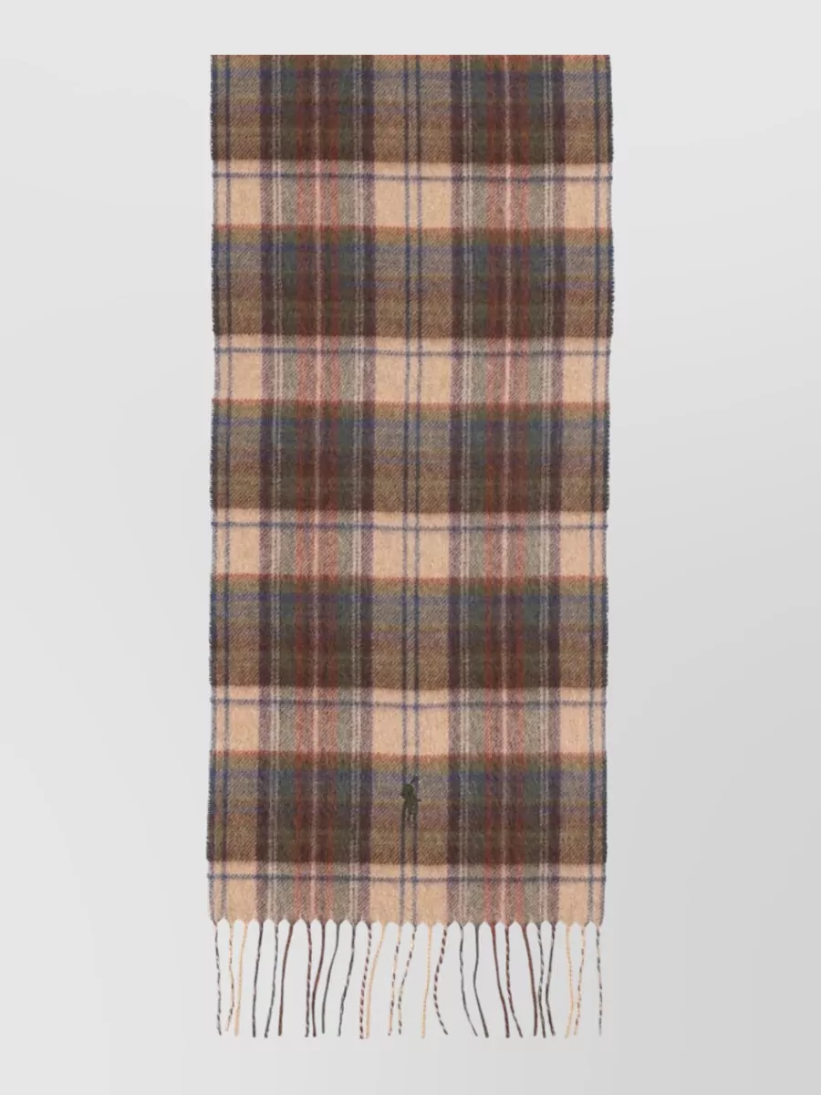 Polo Ralph Lauren Fringed scarf — The camel, brown and blue tartan scarf softly echoes both the trousers’ earthy warmth and the knit’s cool tone, adding a subtle heritage accent without overpowering the palette.