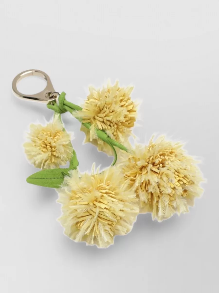 Christian Louboutin brass bag charm