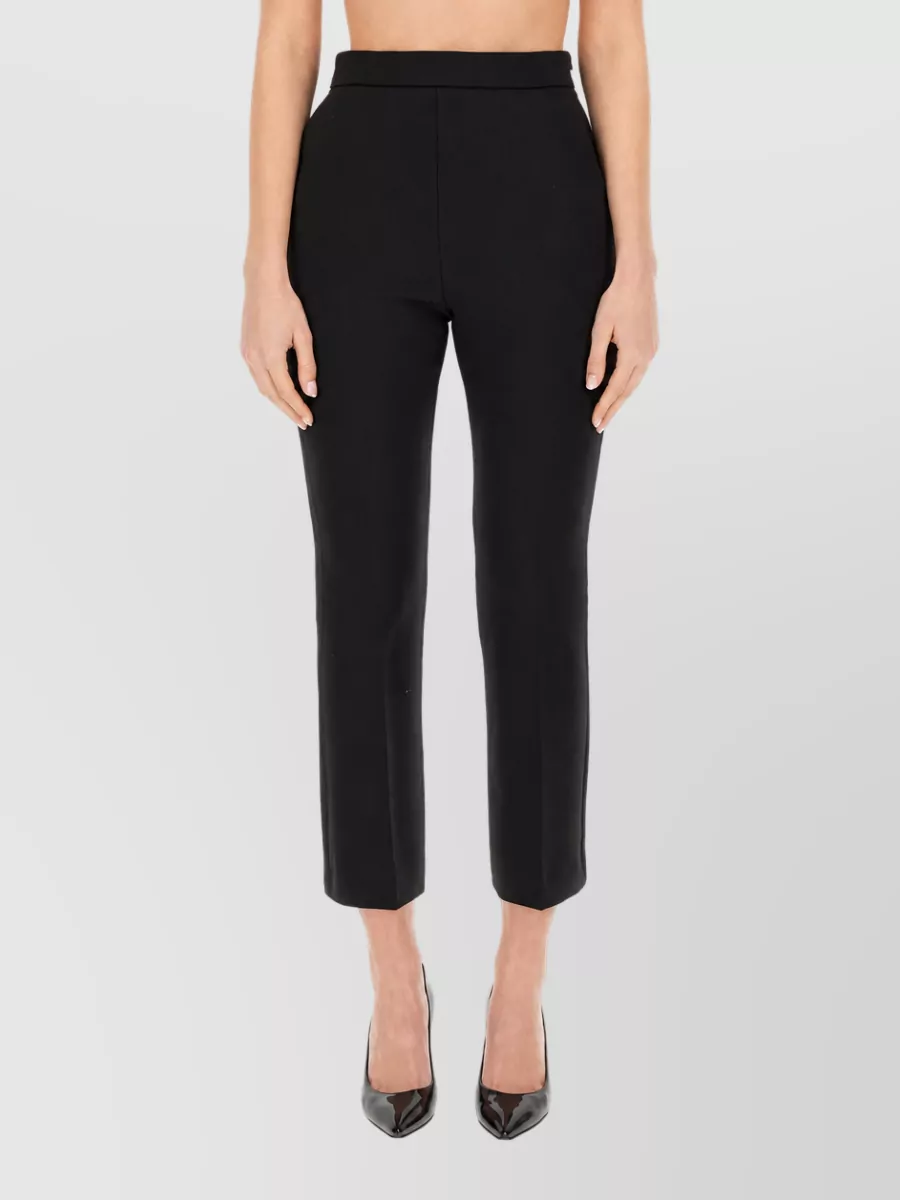 Max Mara Wool cropped trousers — The Max Mara high-rise cropped trouser keeps the outfit in a clean, tailored, quiet-luxury lane and balances the slim tank with a polished, ankle-skimming line that works year-round.