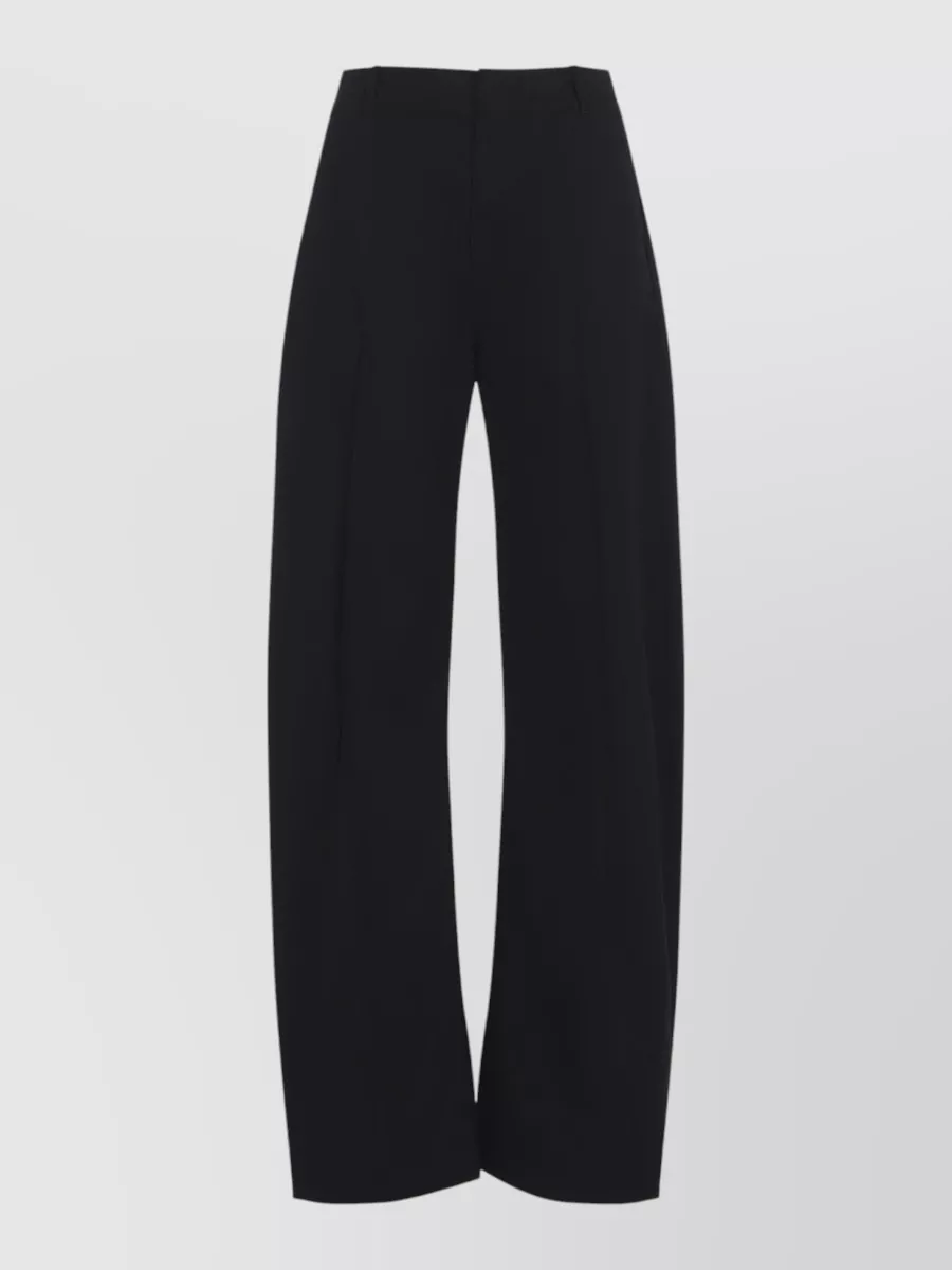Mm6 Maison Margiela Cotton high-rise wide-leg trousers — The high-rise long wide-leg trouser in deep black mirrors the fuzzy knit’s quiet minimalism and elevates it from casual sweatshirt energy into a clean, elongated silhouette that still feels relaxed-street for fall–winter.