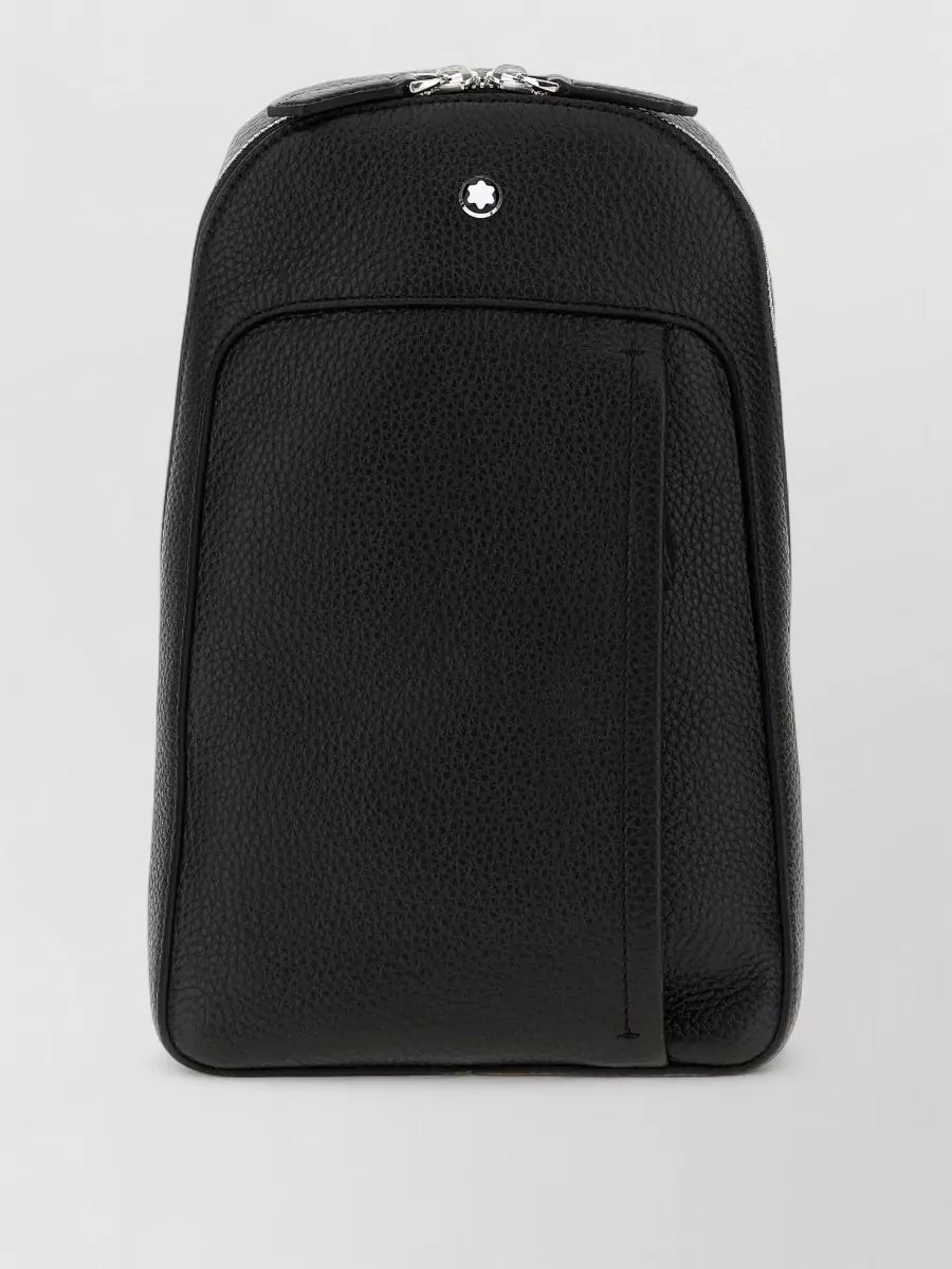 Montblanc Leather backpack — The slim black Montblanc backpack complements the quiet luxury, sport-inflected base with clean lines and a technical-meets-tailored feel that suits city wear with shorts and runners.