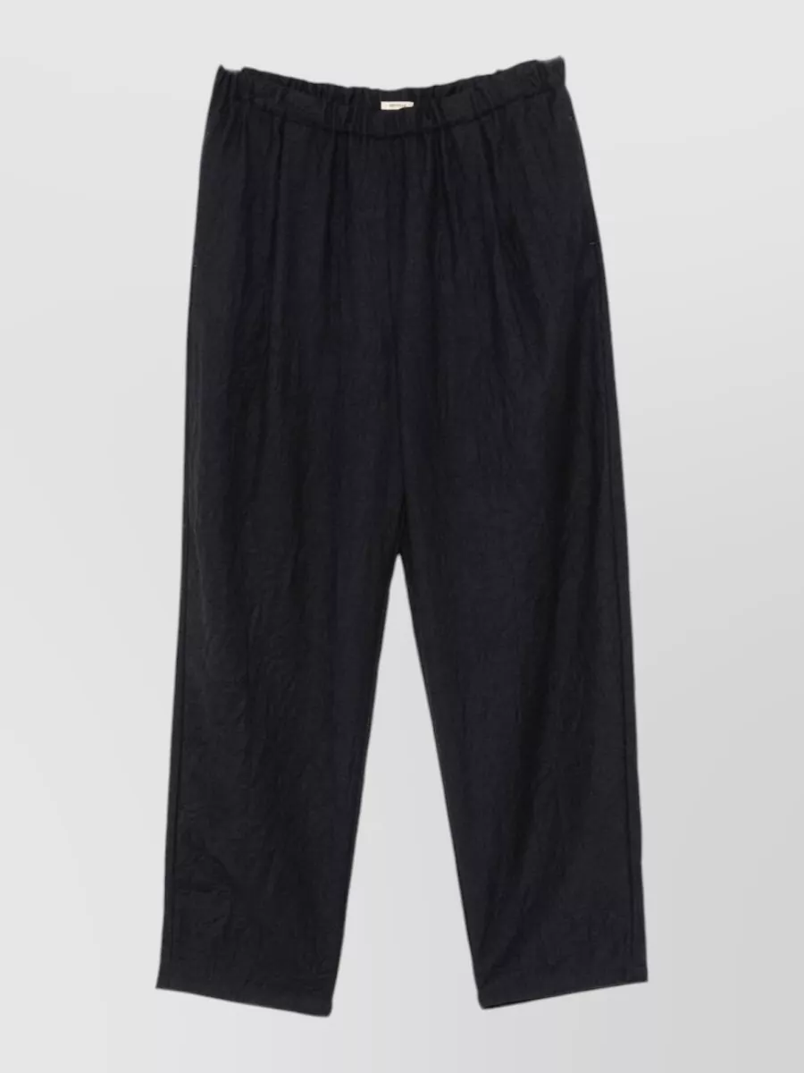 Apuntob virgin wool crinkled tapered trousers