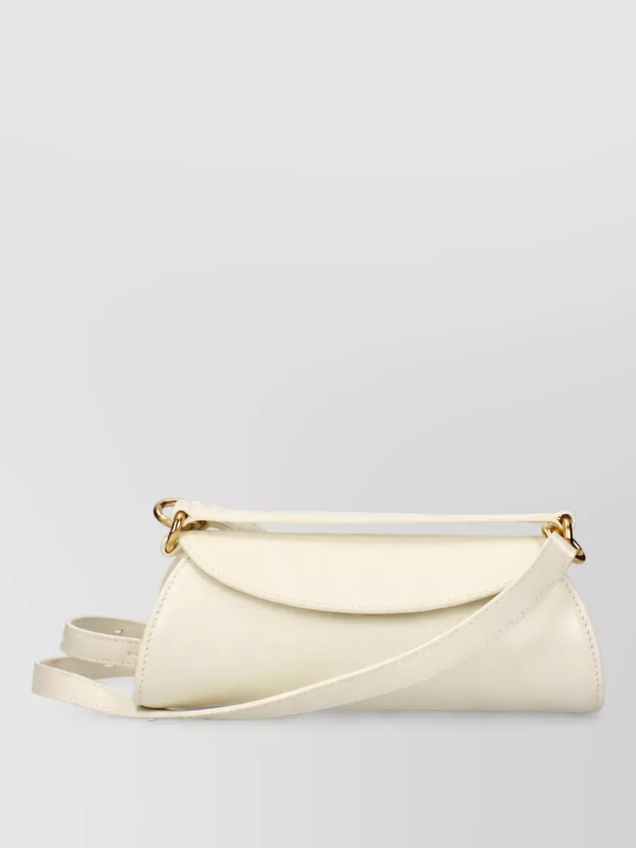 Jil Sander Na leather clutch bag — The slim structured Jil Sander ivory clutch keeps the palette tonal and minimal while its clean gold hardware quietly echoes the blazer buttons and sandals for a cohesive SS tailoring story.