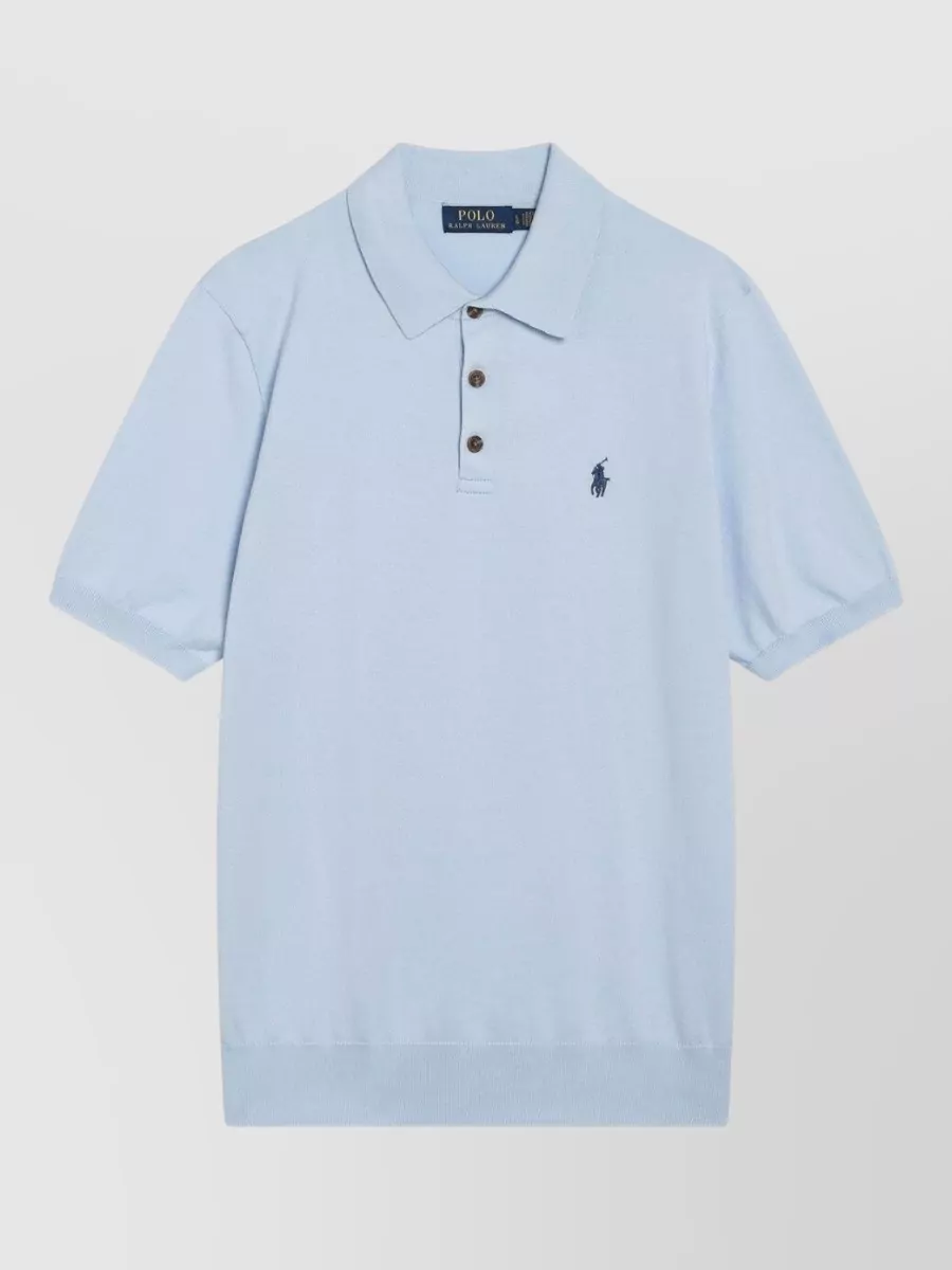 Polo Ralph Lauren Polo shirt — The light blue polo with white logo mirrors the deck shorts’ sky tone for a clean, tonal poolside pairing that stays sporty, preppy and relaxed.