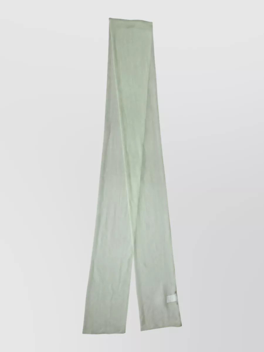 Dolce&Gabbana Silk scarf — The pale mint scarf quietly repeats the shirt’s aqua tones, tying the palette together and adding a romantic, fluid layer without extra pattern.
