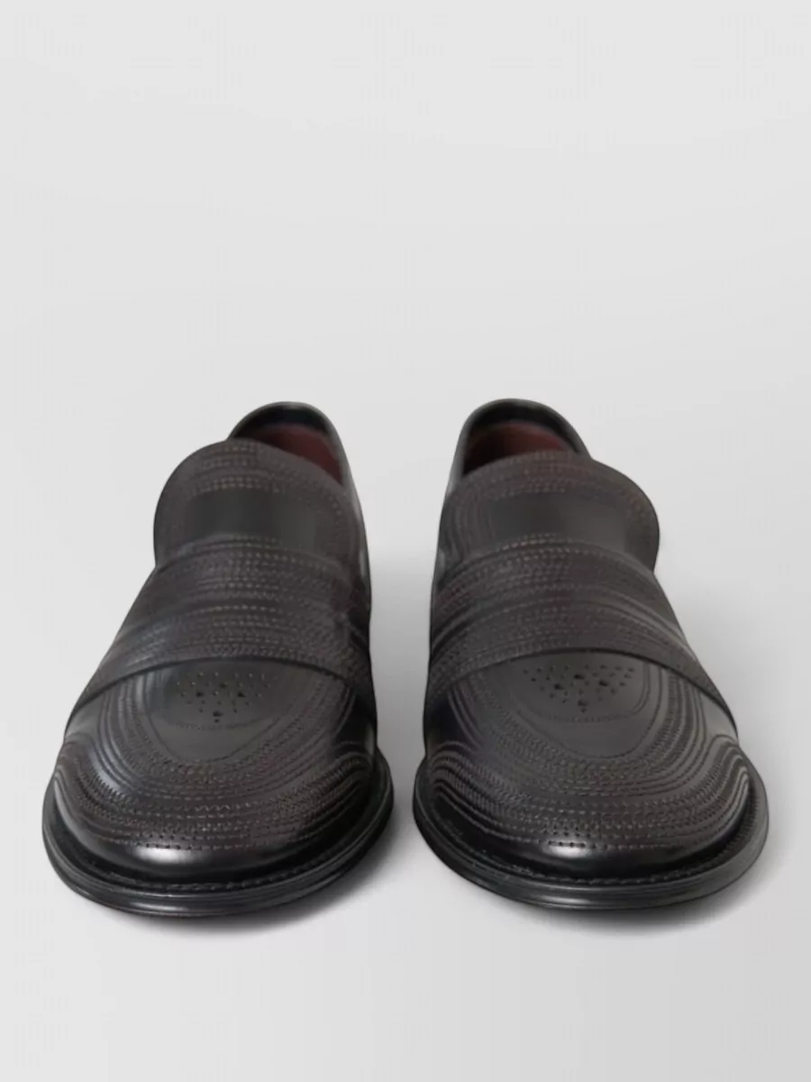 Dolce&Gabbana Leather loafers — The sleek black loafer in F delivers refined, modern evening polish that matches the shirt’s drama and the tailored trouser’s formality without adding loud logos or extra pattern.