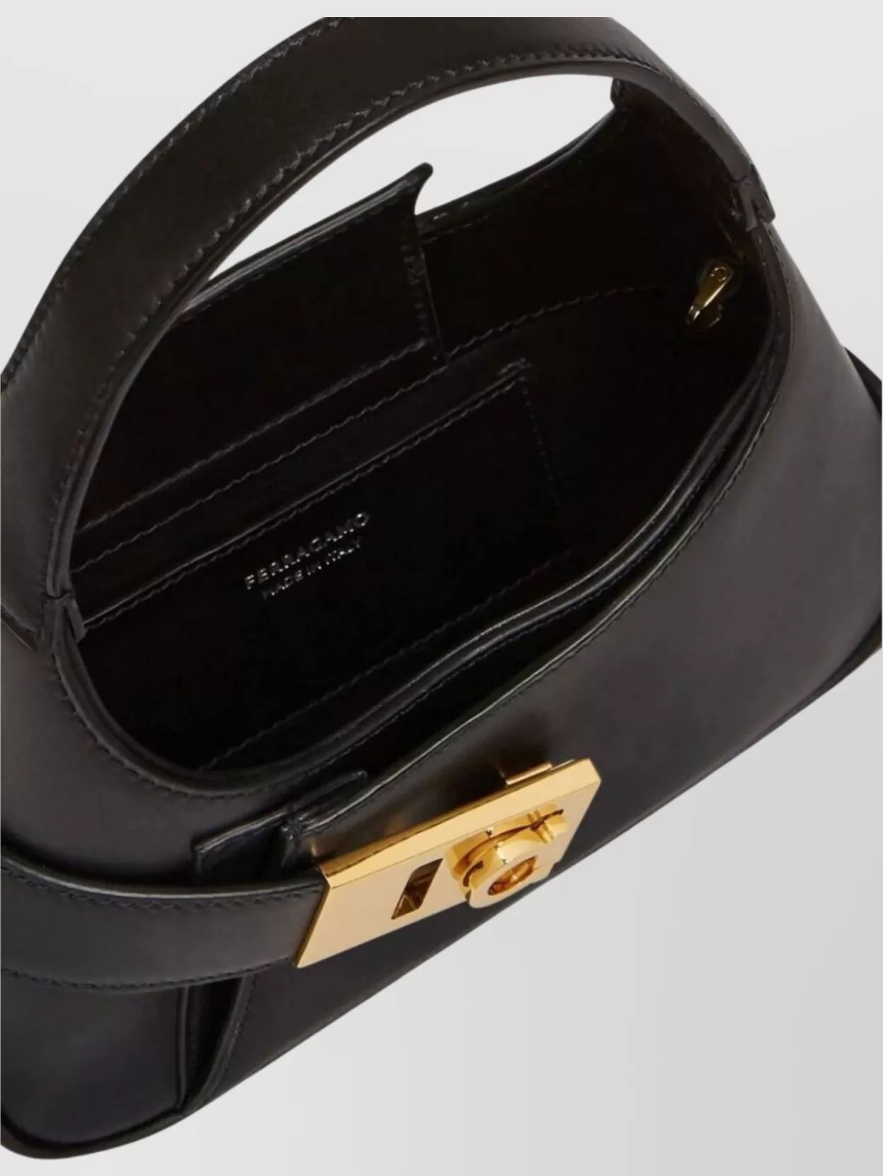 Shop Ferragamo Buckle Front Mini Hobo Bag In Black