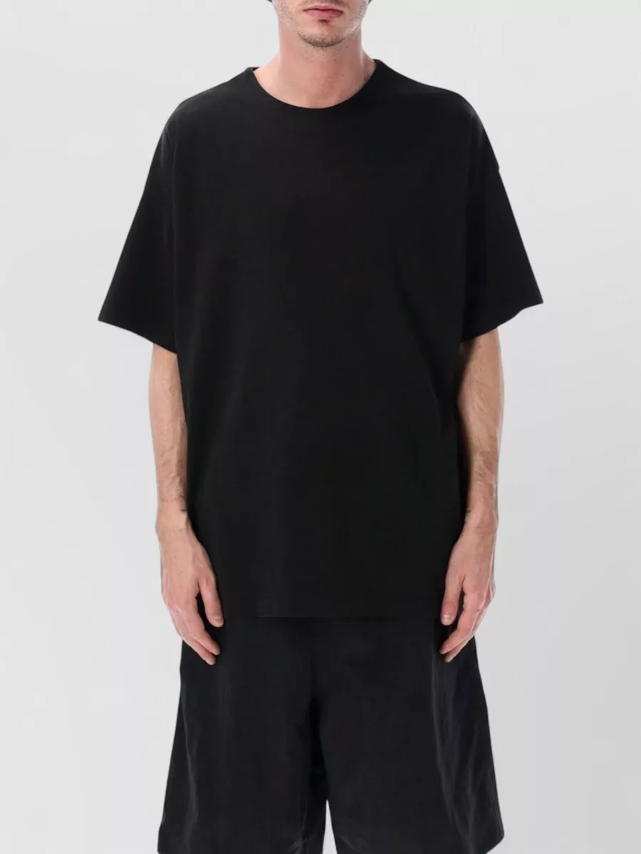 Fear Of God Relaxed-fit crewneck cotton-blend t-shirt — The butter-toned boxy FG tee mirrors the shorts’ relaxed proportion, keeps the palette soft and minimal, and maintains a pure Fear Of God, quiet-luxury story for warm weather.