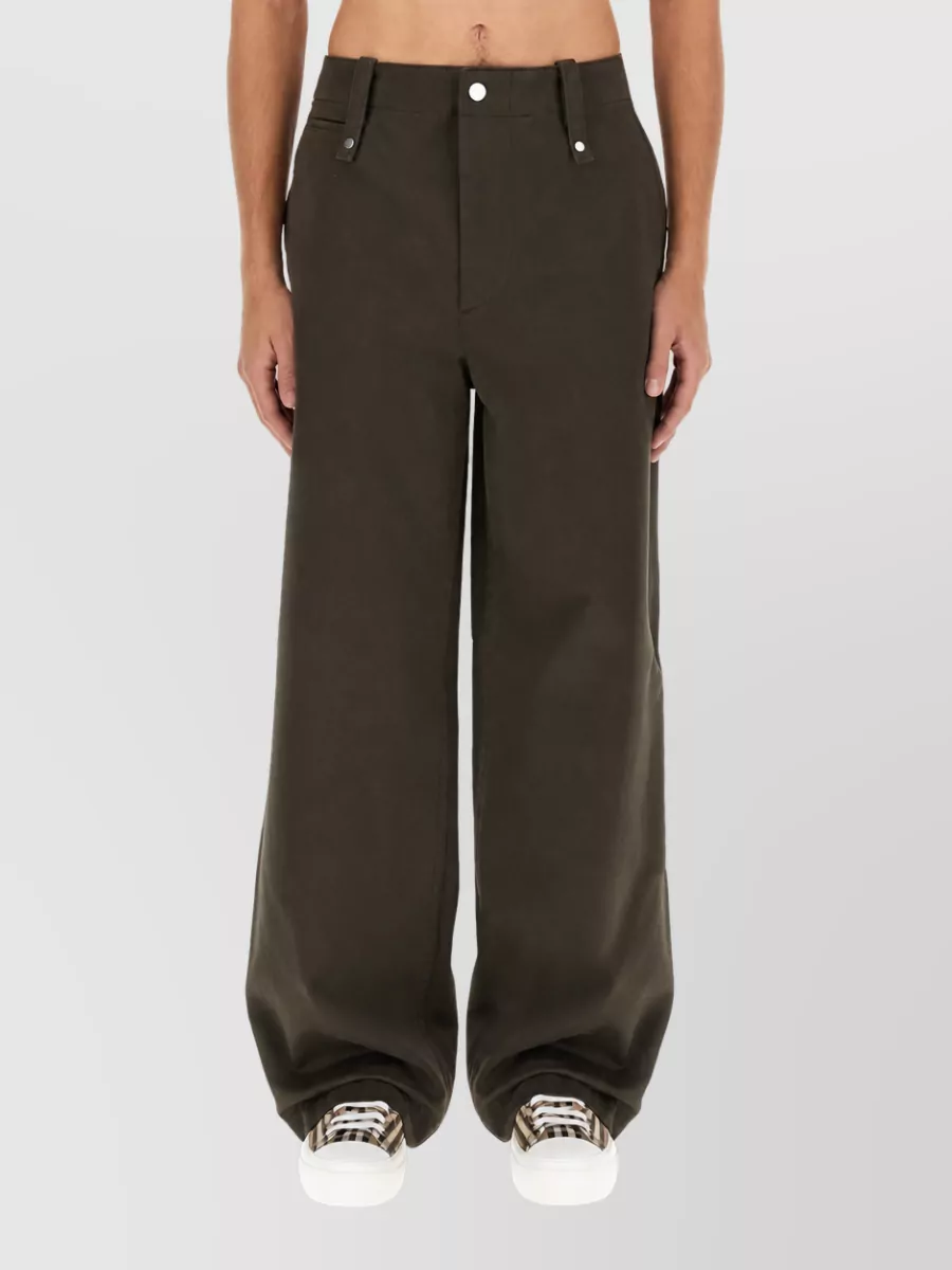 Burberry Cotton wide-leg trousers — The Fendi relaxed taupe herringbone trouser mirrors the coat’s sophistication and warm neutrals, giving a tailored leg that balances the oversized coat in a cohesive monochrome story.