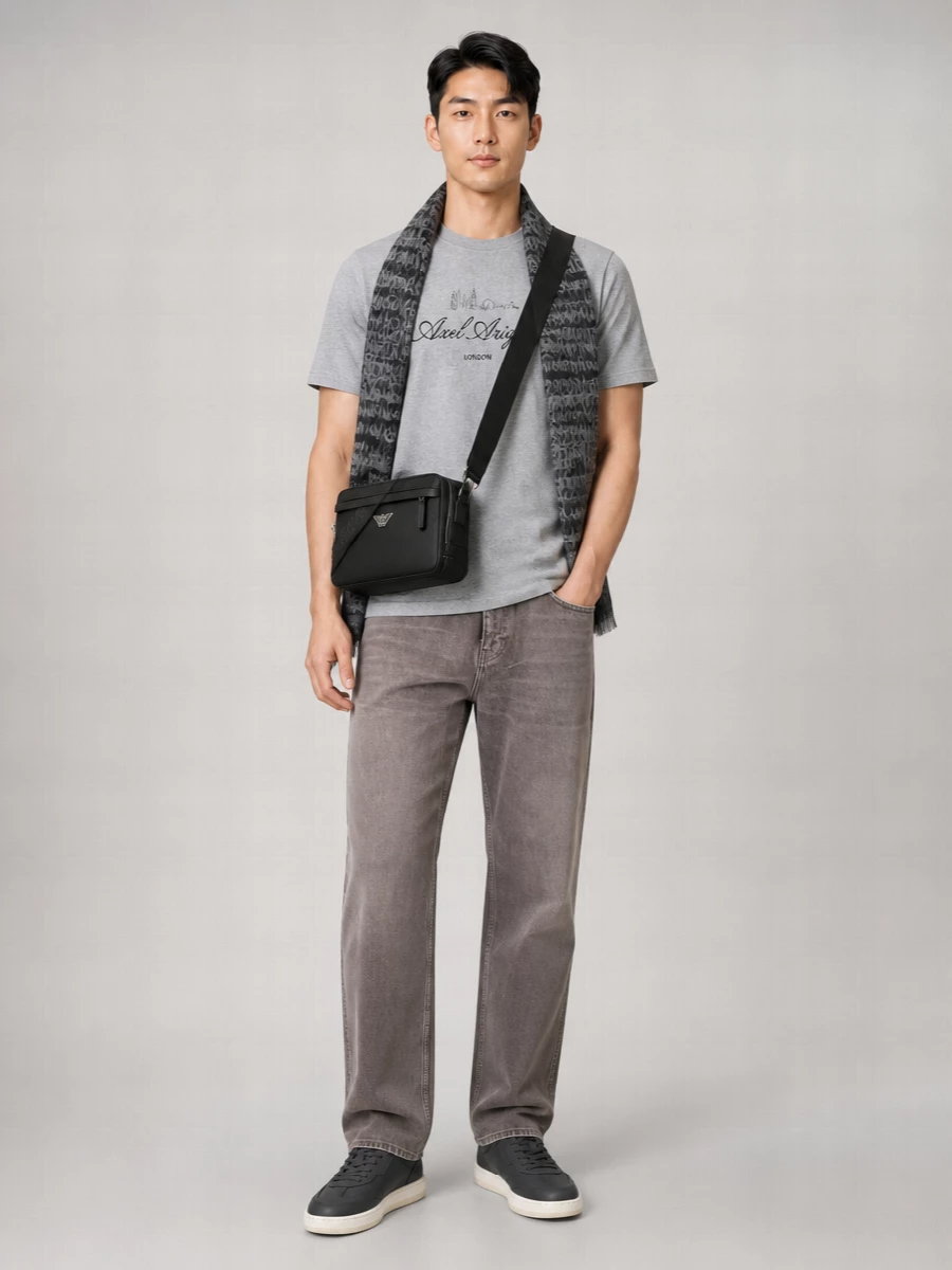 Heather grey on washed taupe-grey denim keeps the palette calm and modern, with just enough contrast between top and bottom to feel considered. Charcoal sneakers and a structured black crossbody pull the city attitude into focus, while the soft logo scarf adds a final layer of texture and warmth. It is a clean, monochrome streetwear uniform that moves easily from daytime errands to casual nights out.