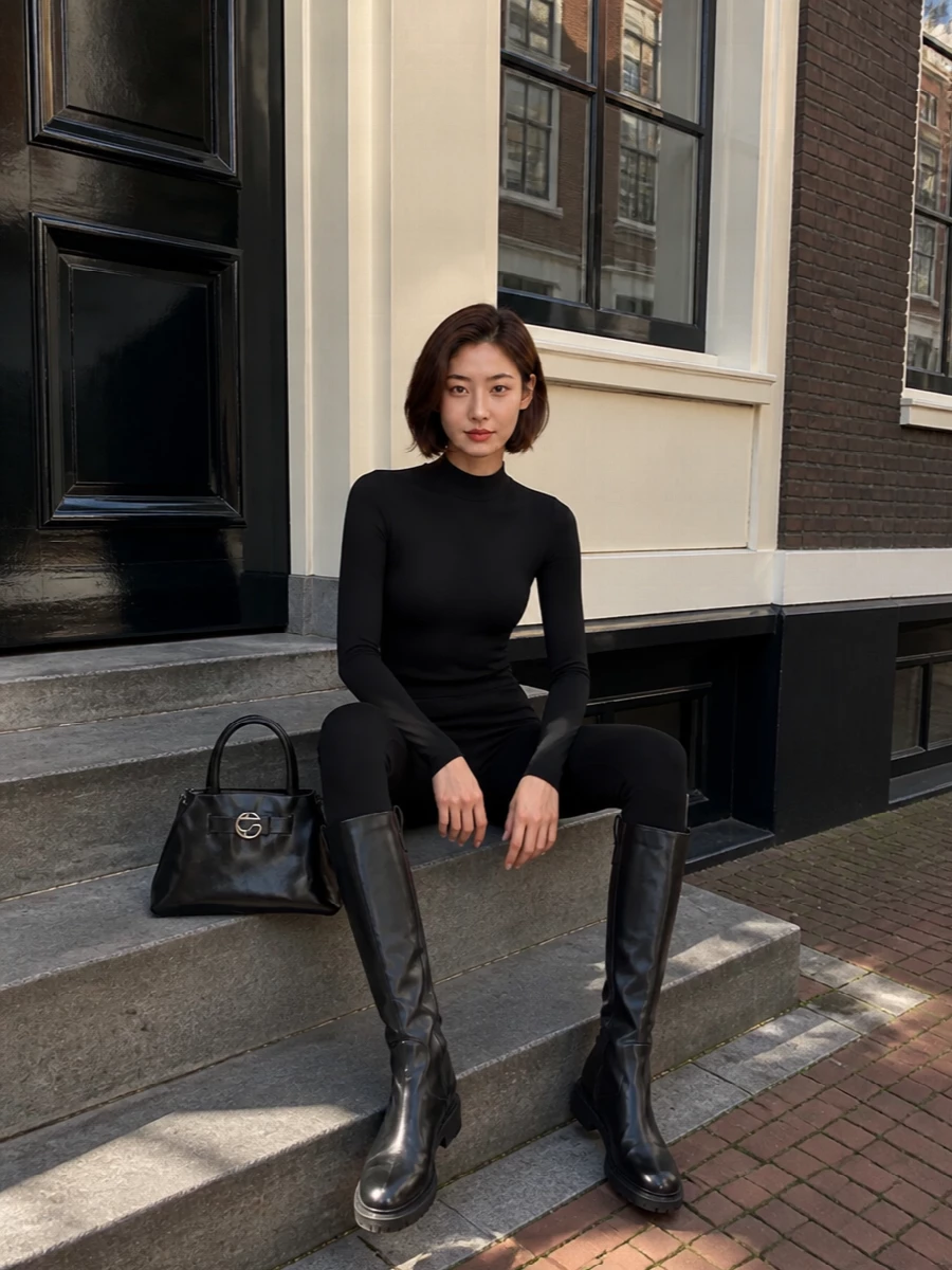 Wolford black leggings aeyde knee boots coperni bag