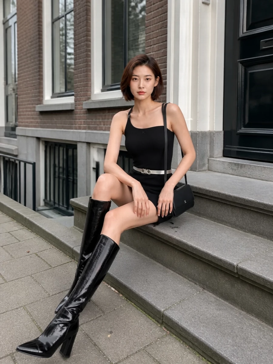 Courreges black mini dress knee high boots outfit