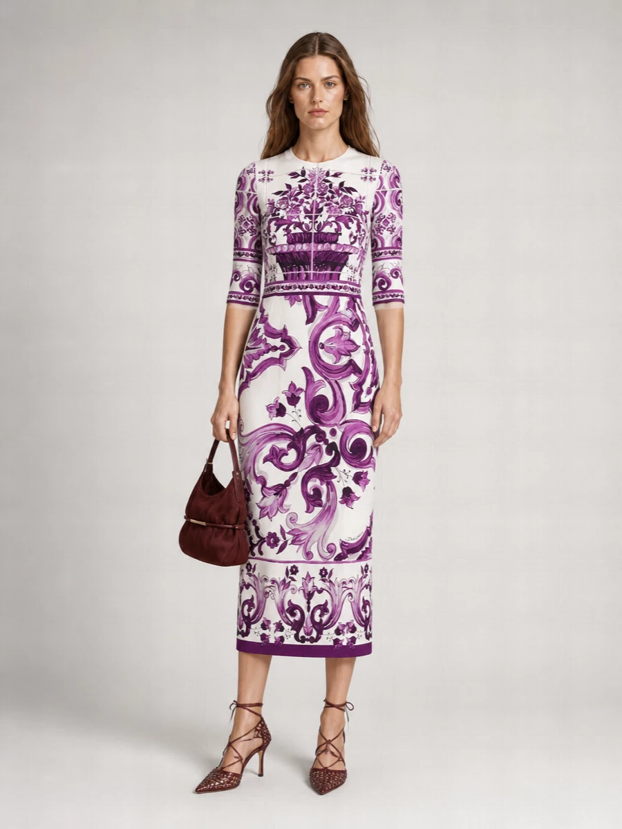 Dolce & Gabbana’s sculpted purple-on-ivory midi is framed with bordeaux accessories for a richer, more intentional fall story than default black. The Bottega sandal and Balmain clutch sit in the same wine family, so the palette reads romantic and tailored rather than matchy or loud, keeping all the drama in the print and the cut. The result is sharp Italian evening glamour that still feels modern and considered from head to toe.